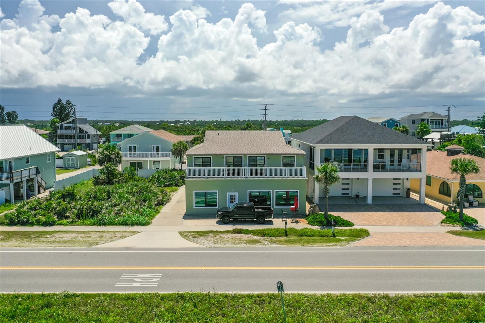 Rare, One of a Kind, Oceanfront Opportunity at 2256 S Ocean Shore in Flagler Beach. Investors will treasure this 4 unit apartment building with strong rental history, beautifully renovated in 2018 along with all those great ocean views to enjoy make this a Don't Miss Gem! Some of the highlights in all units are kitchens with granite counter tops, newer appliances, white Shaker, soft close cabinets and drawers, vinyl plank flooring. New balconies on upstairs units. Upstairs units have washers & dryers. All units have new hurricane impact windows & sliders. Exterior Paint in July, 2025. Dune Easement included!! So many extras a Full Feature Sheet with rental information is attached in the document folder. Termite Bond along with A/C yearly maintenance included through 2025.