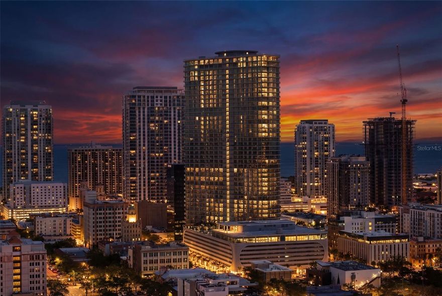 One or more photo(s) has been virtually staged. Rare opportunity to own a premier end residence at 400 Central in the heart of downtown St. Petersburg. Residence #2307 offers over 2,600 sq ft of light-filled living space and an extraordinary 1,000+ sq ft wraparound terrace with a distinctive curved design that captures sweeping east, south, and north views of the city skyline and Tampa Bay. The unique curvature of this end unit creates an expansive outdoor living experience rarely found in downtown high-rises. Designed for seamless indoor-outdoor living, every bedroom features sliding glass doors opening directly to the terrace. Floor-to-ceiling glass fills the home with natural light, complemented by porcelain tile flooring and a chef’s kitchen with gas range. Located in the tallest residential tower on Florida’s west coast, 400 Central offers resort-style amenities, a pet-friendly lifestyle, and walkable access to downtown St. Pete’s renowned dining, shopping, waterfront parks, and cultural attractions.