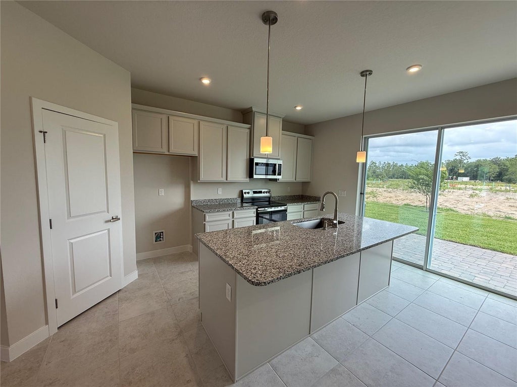 Photo of 1247 Pineywood Field Drive, Davenport, FL 33837 (MLS # W7885332)