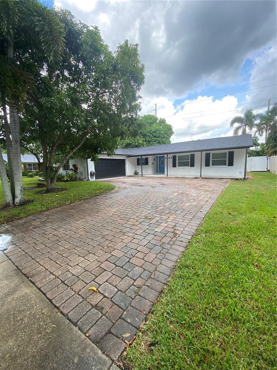 LIVE where Everyday feels like a Vacation in this Tropical Paradise POOL home just minutes from Downtown Orlando!! Upon entering the driveway, you'll immediately notice the massive Mango Fruit Tree and the huge Pavers driveway with plenty of room to fit 4-5 vehicles, in addition to the oversized and freshly painted 2-car garage. Upon entering the home, you are greeted by a large open concept living/kitchen/dining room combo with plenty of natural lighting, polished ceramic tile flooring overlooking the luxurious screened in pool area. Explore your inner chef in the heart of the home in this gorgeous upgraded kitchen equipped with Granite countertops including a MASSIVE island for your bar stools and prep space that has 2 hidden pop up electrical outlets with additional USB ports, craftsman wooden cabinets, tiled backsplash, Stainless Steel appliances including a WiFi Smart Refrigerator/Freezer with Ice Maker, and elegant chandelier light fixtures for added charm. The family room features a built-in entertainment center surrounding the color changing electric fireplace with 2 sofas and a coffee table included. Access to the screened patio through 2 different sets of sliding glass doors, or outside of the double french doors. The Master Suite also offers the polished ceramic tile flooring, generous closet space, also with sliding glass doors for more beautiful views of the pool. Also equipped with an upgraded En-Suite Master Bathroom that features a remodeled walk-in tiled shower with a rainfall shower head and handheld combo, Granite countertop and new cabinets, with an exit door for easy access to the pool. The other guest two bedrooms are generously sized, with real hardwood flooring, and share a nicely upgraded guest bathroom, with Granite countertop and the shower overlooks the pool in addition to also having a rainfall shower head/handheld combo. Plantation shutters throughout the windows of this property to enhance the mesmerizing views of the custom built cascading waterfall and a LARGE pool in the newly fenced backyard for added privacy to your backyard oasis. Enjoy the privacy of lounging by the pool listening to the therapeutic sound of the cascading waterfall or sip your morning coffee in the huge screened in patio providing ample space for hosting and entertaining your guests, including an outdoor grill and table set with charming lighting, and the newly installed outdoor electrical outlets for added convenience. Enjoy Public Lake Access with a Boat Ramp to the popular Lake Jessamine. Professionally deep cleaned, painted, and Move In Ready!! Conveniently located minutes from the SoDo district shopping area, Downtown Orlando, Lucky's Market, and top-rated local restaurants. Schedule your private showing Today to make this luxurious residency YOURS!!
