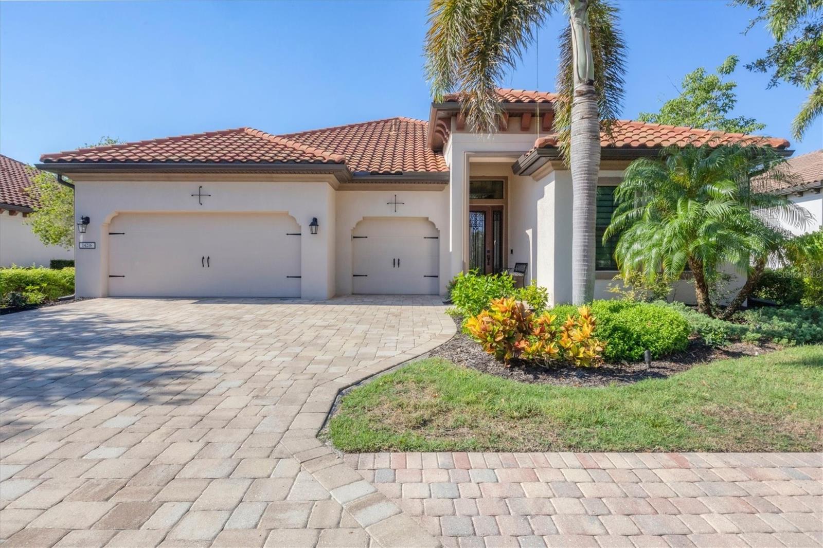 Step through the front door and take in the captivating view of the heated pool and tranquil waterfall, beautifully framed by an expansive vestibule that immediately sets the tone for this elegant, well-appointed home. Situated at the end of a quiet cul-de-sac, this property offers exceptional privacy and minimal traffic; an ideal retreat.
The extra-wide driveway leads to a spacious 3-car garage, surrounded by lush, mature landscaping and new gutters and downspouts (2024) that enhance both form and function. Inside, you’ll find soaring 12-foot ceilings, architectural windows, and an extra-deep 16-foot lanai, perfect for entertaining or relaxing in the Florida breeze.
With no wasted space, this thoughtfully designed floor plan features three oversized bedrooms, offering generous room for rest and comfort. A versatile flex room with a closet provides options for a 4th bedroom, home office, media space, or gym—whatever suits your lifestyle best.
Throughout the home, you'll find a blend of style and quality, including a metallic feature wall in the great room for a modern designer touch and high-end wallpaper in the bathrooms that adds a luxurious feel. The built-in dining buffet is highlighted by under and over cabinet lighting, adding ambiance and visual appeal.
Functionality and convenience continue with a kitchen reverse osmosis water system with a line to the icemaker, custom window shades, tinted windows, and a laundry room complete with custom cabinetry, hanging space, granite countertops, and an integrated sink.
The owner’s suite includes a built-in command center/office nook, perfect for working from home or staying organized. Both the office and bedroom 2 are equipped with custom closets, maximizing storage and efficiency.
Enjoy added peace of mind with an in-wall electrical transfer connection and modified breaker panel designed for generator hookup—eliminating the typical noise from weekly whole-house testing. Additional maintenance details include consistent HVAC and pest control service, rodent exclusion, and upgrades such as mesh barriers on the pool heater, roof junctions, lanai floor drains, and pool overflow piping.
This maintenance-free home also boasts no history of flood damage, making it as dependable as it is beautiful. Residents enjoy access to The Retreat, an exclusive amenity center with a resort-style pool, fitness center, and billiards room, while nearby The Residents Club offers a second pool, spa, and sand volleyball court.
Golf and sport lovers will appreciate the proximity to the Lakewood Ranch Golf & Country Club, with optional memberships providing access to 72 holes of championship golf, 20 Har-Tru tennis courts, 20 pickleball courts, multiple pools, a grand clubhouse, and The Lodge bar and restaurant.
This home effortlessly combines luxury, practicality, and resort-style living in the heart of Lakewood Ranch—a truly exceptional opportunity.