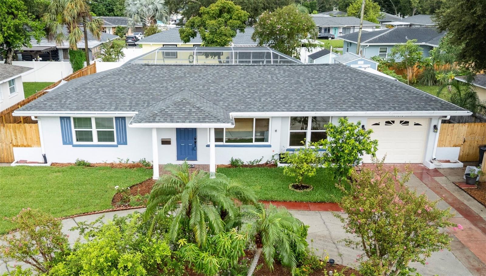 Welcome to your dream oasis in St. Petersburg's coveted Harshaw neighborhood! This beautifully updated 3-bedroom, 2-bathroom single-story home offers the perfect blend of modern convenience and natural living, all situated in a desirable non-evacuation zone that stays high and dry. The circular driveway and manicured front landscaping create an impressive first impression, while the welcoming front porch adds timeless charm. The one-car garage provides convenient covered parking and storage. Step into luxury with original stained glass interior doors and extensive recent renovations including a brand-new roof (August 2025), a completely renovated kitchen (2023), an updated master bathroom (2024) and new fencing. The home features impact hurricane windows and doors throughout, making the home eligible for valuable insurance discounts while providing peace of mind during storm season. Your backyard paradise features recently replaced pool equipment (2024) and includes a solar heater that can be easily reinstalled for energy-efficient swimming year-round (was uninstalled during roof replacement and can be reinstalled). A sizeable shore-powered shed offers ample space for tools, projects, and outdoor equipment. This property is a gardener's and chef's paradise! Enjoy the unique benefit of irrigated planter beds perfect for growing your own vegetables and flowers. The established fruit trees and herb garden include key lime and Meyer lemon trees, Barbados cherry and mango trees, moringa and bay leaf trees, as well as fresh rosemary. Breathe easy with the advanced HVAC system featuring a UV Light system (Remy Halo) and a sealed attic that prevents dust and particles from entering your living space, ensuring exceptional indoor air quality. Located in St. Petersburg's sought-after Harshaw neighborhood, you'll enjoy the perfect combination of residential tranquility and urban convenience, all while being positioned in a safe, non-evacuation zone. This rare find won't last long! Schedule your showing today and discover the unique lifestyle this exceptional property offers.