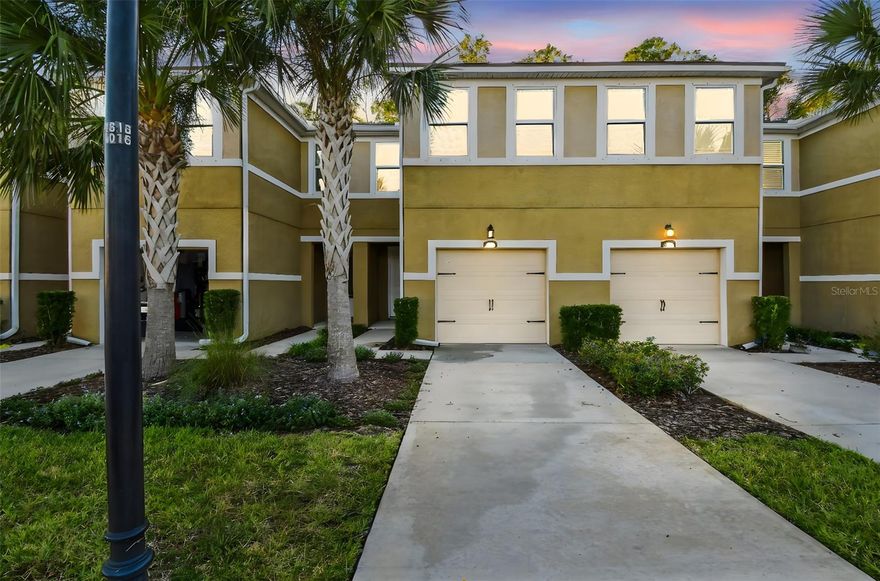 Welcome to your dream home where comfort, style, and convenience meet! This 3-bedroom, 2.5-bath townhome features an open-concept layout with a modern kitchen showcasing granite countertops, tile backsplash, stainless steel appliances, and an island. The spacious living area opens to an enclosed patio with serene views. Upstairs offers a loft, laundry room, and a private primary suite with tray ceiling, dual walk-in closets plus an extra third, and a luxurious bath with dual vanities and glass shower. Laminate flooring throughout the second floor—no carpet! Enjoy maintenance-free living and a sparkling community pool just steps away. Conveniently located near the Veterans Expressway, shopping, dining, and top-rated schools in Lutz. East Facing.