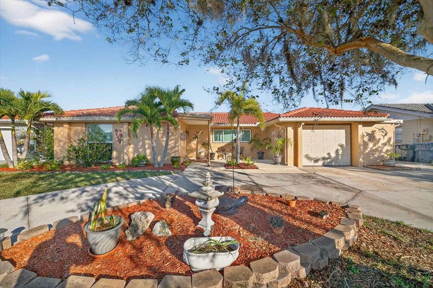 Completely renovated coastal retreat in Gulf Harbors! This stunning 3-bed, 2-bath waterfront pool home blends modern elegance with true Florida living. Fully permitted renovations, electrical updated (2025), roof (2016), granite kitchen counters, and upgraded finishes create a bright, modern interior from the moment you walk in. The beautifully updated kitchen features crisp cabinetry, granite surfaces, stainless appliances, and panoramic sightlines straight out to the water. The home offers multiple spacious living areas with tile and laminate flooring throughout, allowing you to entertain or relax with ease. A unique bonus: one of the bedrooms connects directly to the primary suite with a stylish barn door, making it ideal for a private home office, nursery, fitness room, or an additional bedroom—a rare, flexible layout that enhances livability. Step outside to your private oasis—screened pool, large covered patio, and your own dock with 13,000lb boatlift, giving you effortless access to the Gulf. This property also features a rare over-water rear deck and outdoor entertaining area, perfect for cocktails at sunset or hosting gatherings right at the water’s edge. The circular driveway adds convenience and curb appeal, complemented by fresh landscaping and Mediterranean-style charm. Both bathrooms are freshly updated, and every detail of this renovation was carefully completed for a truly move-in-ready experience. Available private Gulf Harbors Beach Club access available for just $240.00 a year! Live the Gulf Harbors lifestyle with boating, sunsets, and coastal breezes right at your doorstep—a fully renovated gem ready for its next chapter.