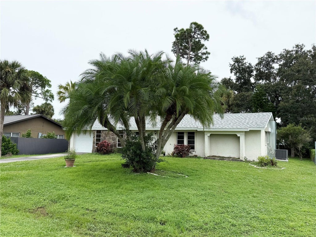 Photo of 2274 Lakeshore Circle, Port Charlotte, FL 33952 (MLS # C7531546)