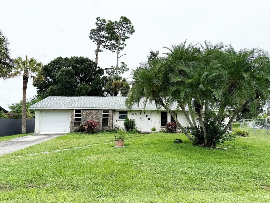 Photo of 2274 Lakeshore Circle, Port Charlotte, FL 33952 (MLS # C7531546)