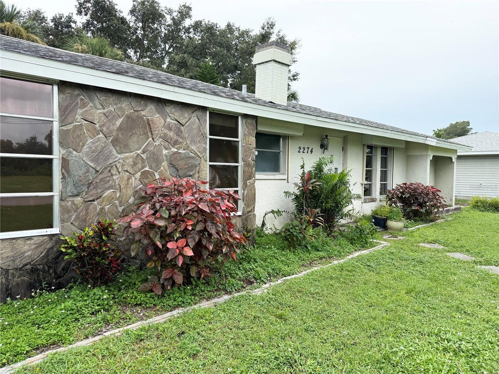 Photo of 2274 Lakeshore Circle, Port Charlotte, FL 33952 (MLS # C7531546)