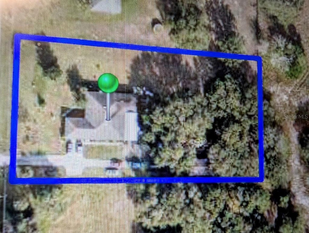 Photo of 310 Tomato Hill Road, Leesburg, FL 34748 (MLS # OM729601)