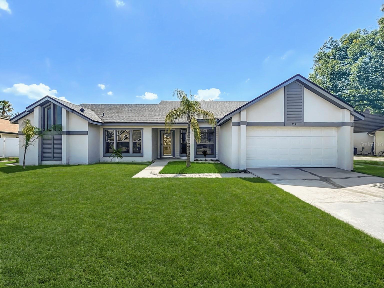 Welcome to your future home in the heart of South Orlando! This freshly painted and renovated 3-bedroom, 2-bath home is located in the highly desirable Whisper Lakes community. The spacious split floor plan offers a large great room featuring high vaulted ceilings, a wood-burning fireplace, a bright eat-in kitchen, two versatile living areas, and an oversized primary suite with an en suite bath, double vanity, and sliding doors leading to the backyard. Enjoy a fully fenced yard with a paved patio—perfect for outdoor entertaining, gardening, or play. There’s ample space to add a pool. The attached 2-car garage includes a convenient laundry area. Recent updates include a brand-new roof (2025) and a newer HVAC system (2020), full interior paint, and dining room hardwood flooring. Ideally situated with easy access to major highways including I-4 and the Florida Turnpike, as well as Downtown Orlando, Orlando International Airport, shopping, dining, and theme parks. Zoned for sought-after schools and close to parks and recreation. Don’t miss this opportunity—schedule your showing today!