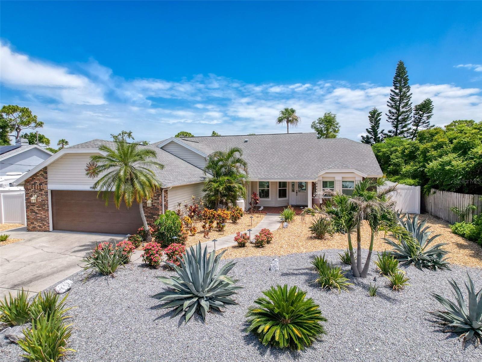 Just steps from the white sands of Sunset Beach, this stunning 4-bedroom, 3-bath, salt-water POOL HOME offers the best of Florida living in a peaceful, walkable, UPSCALE Tarpon Springs neighborhood. Situated on a spacious lot just under a quarter acre, this superbly maintained home is full of upgrades, natural light, and coastal charm. The layout features vaulted ceilings, a large living room with fireplace, formal dining space, breakfast room, and a separate family room with another fireplace ideal for entertaining. The generously sized kitchen has been updated with classic wood cabinetry, stainless steel appliances, and ample counter space for meal prep or gathering with guests. The split-bedroom layout provides privacy for the large master bedroom suite, which includes a slider to the pool, TWO walk-in closets with thoughtfully planned wood shelves, and en-suite bath with double sinks and water closet with walk-in shower. A separate room within the master bedroom is perfect for a home office, reading room, nursery, storage -- you decide!
Three additional bedrooms are located on the opposite side of the home with TWO full baths nearby. One bedroom features an EN-SUITE FULL BATH, making it ideal for guests or multigenerational living. The home features durable flooring throughout -- no carpet! Two sliders lead out to a screened-in lanai with a heated, self-cleaning pool and spillover spa, surrounded by easy-care landscaping and FULLY FENCED for pets, people, and privacy. Enjoy year-round outdoor living with plenty of space for lounging, grilling, or entertaining.
The oversized 2-car garage offers plenty of storage and space for working. Located in a golf cart-friendly community with no HOA or CDD, this home is a short walk to Sunset Beach and just minutes from Fred Howard Park, the famous Sponge Docks, marinas, restaurants, and shopping. Zoned for top-rated schools and surrounded by natural beauty, this property is ideal as a full-time residence, vacation home, or investment opportunity. Don’t miss your chance to live the Florida beach lifestyle without sacrificing space, comfort, or convenience.
Ask about the over $200,000 worth of upgrades made to this home, including water softener, spa heater which can heat the pool, healthy salt water pool system, new septic, HVAC purifier, and so much more.