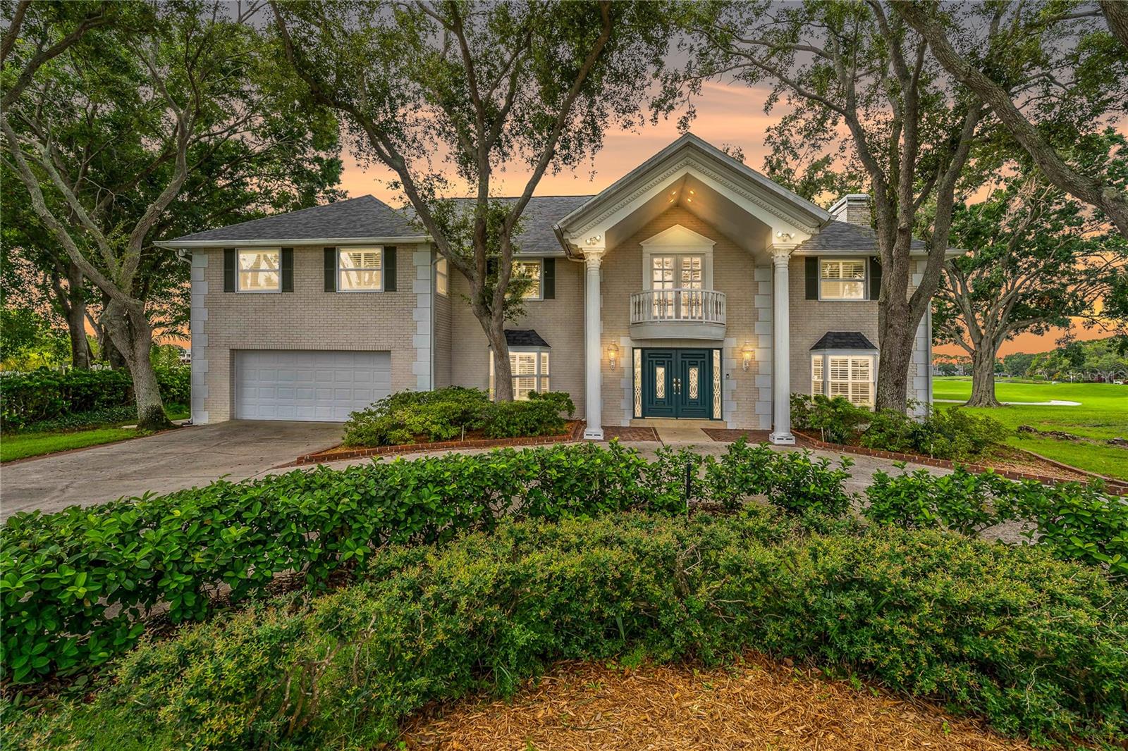 Step into timeless elegance in this stunning Colonial-style estate home located in the heart of Feather Sound ~ one of Clearwater’s most sought-after golf course communities. With 4 bedrooms, 3 full bathrooms and over 4,800 square feet of beautifully designed living space, this impressive home is perfectly positioned on the prestigious Feather Sound Country Club Golf Course. Enjoy panoramic views from nearly every angle, with the backyard overlooking the 17th hole and 18th tee box, while the front of the home gazes across the 2nd and 11th holes. From sunrise to sunset, the scenery is nothing short of spectacular.
As you arrive, you’re greeted by a circular driveway and a grand entrance that sets the tone. Step inside the marble-floored foyer and be immediately impressed by the sweeping oak staircase and luxurious details that carry throughout the home ~ fluted molding, wood-burning fireplaces with fossil stone accents, plantation shutters and a built-in surround sound system. Everything has been thoughtfully designed and meticulously maintained, including a brand new roof (2025), a new water heater (2024), and three zoned A/C units (2024, 2018, 2018).
The heart of the home is the beautifully appointed kitchen featuring granite countertops, a spacious island, white cabinetry with pull-out drawers, new KitchenAid appliances, a wine fridge and a breakfast nook with French doors that open out to your private lanai and pool area. Whether you’re hosting a holiday dinner or a casual pool day, the layout offers flexibility with a large family room, formal dining room and formal living space ~ perfect for entertaining!
The expansive primary suite feels like its own private retreat. Enjoy a luxurious walk-in closet with a custom storage system, a cozy fireplace, a built-in coffee bar with refrigerator and microwave, and a spa-like bathroom featuring a walk-in shower, soaking tub and dual sink vanity. You’ll also have direct access to the second-floor balcony to enjoy peaceful mornings or unwind in the evening.
Out back, relax in your own slice of paradise ~ complete with a screened-in 20,000-gallon pool and covered patio area overlooking the gorgeous golf course views! And with one of the highest elevations in Feather Sound, you’ll have added peace of mind.
Feather Sound offers a private club experience without HOA fees or deed restrictions. Optional memberships are available for golf, tennis and the clubhouse. Located just minutes from beaches, downtown St. Pete, Tampa, Safety Harbor and two international airports ~ this home is the perfect blend of luxury, comfort and location.