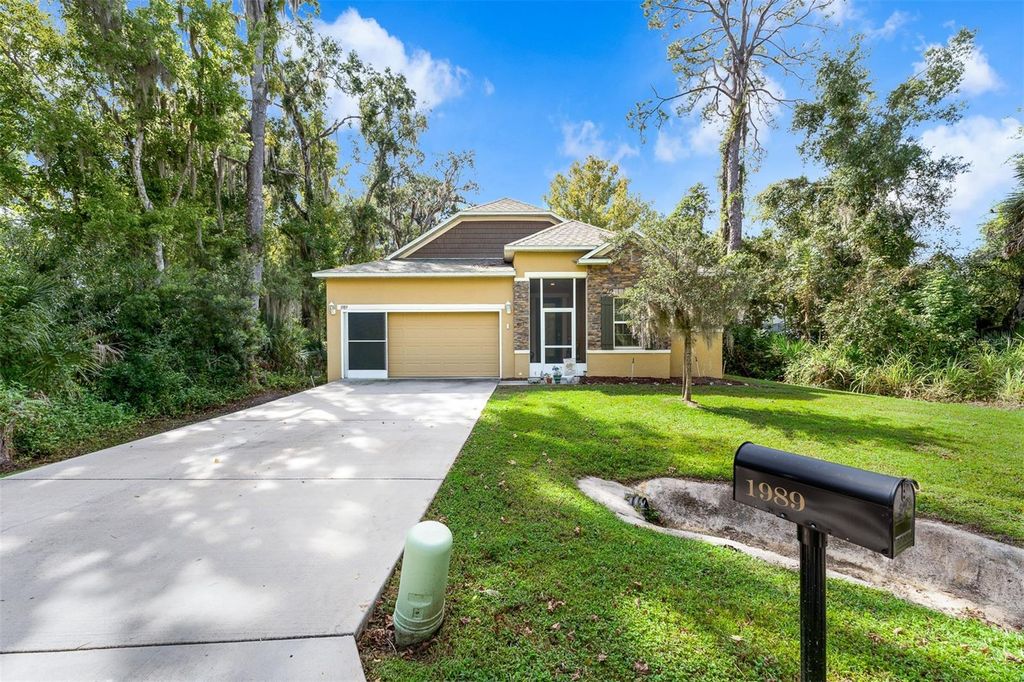 Photo of 1989 Marsh Hen Village, Deland, FL 32720 (MLS # O6348458)
