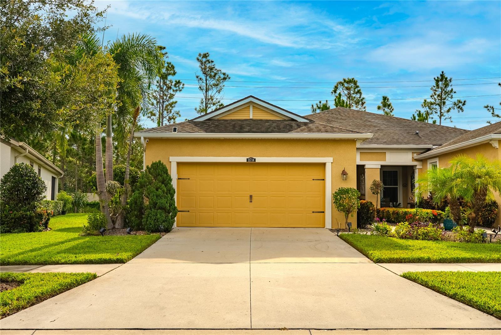 Impeccably maintained 3-bedroom, 2-bath home and a 2-car garage—where comfort and quality meet. Elegant crown molding and rich wood-plank flooring anchor the main living areas. The chef’s kitchen features granite countertops, extended cabinetry with crown, under-cabinet lighting, and premium stainless steel appliances (Samsung refrigerator; Frigidaire range & dishwasher—installed within the last year). The spacious great room offers upgraded recessed lighting and a three-panel sliding glass door opening to a private, covered lanai with brick pavers—ideal for everyday living and entertaining.
The owner’s suite provides a quiet retreat with a tray ceiling and a custom walk-in closet by Closet by Design. Additional highlights include double-pane, gas-filled energy-efficient windows, an upgraded security system, washer and dryer, custom curtains and blinds, overhead garage storage racks, an integrated ceiling-speaker system in the living room and lanai, a whole-home water softener, and a drinking-water mineralization system. Termite perimeter treatment and scheduled pest control every four months provide added peace of mind. Situated on an interior loop with no homes directly in front. Select TVs may convey. Truly move-in ready—schedule your private tour today.