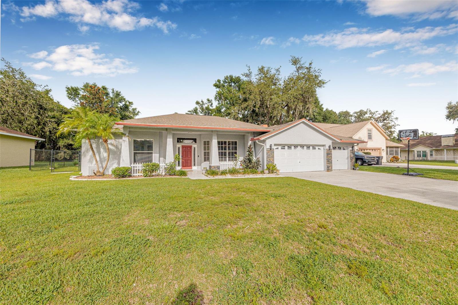 Completely Updated 4 Bed | 3 Bath | 3-Car Garage Home on a Private Half-Acre Fruit-Filled Lot!
Welcome to this beautifully renovated 4-bedroom, 3-bathroom home with a spacious 3-car garage, nestled on a peaceful half-acre lot. Thoughtfully updated inside and out, this home offers the perfect blend of luxury, functionality, and charm, all set against a backdrop of lush tropical landscaping and mature fruit trees.
As you enter, you’re immediately greeted by soaring 12-foot ceilings, a bright open floor plan, and elegant finishes throughout. The home features both a formal living room and a family room, providing ample space for entertaining or relaxing. A cozy fireplace creates a warm focal point in the main living area, while ceiling fans and light dimmers throughout the home ensure comfort and ambiance in every room.
The heart of the home is the stunning, fully updated kitchen. Here, waterfall granite countertops make a striking statement, paired beautifully with crisp white cabinetry, a designer tile backsplash, stainless steel appliances and a generous walk-in pantry with custom wood shelving make this kitchen as practical as it is beautiful—ideal for cooking, hosting, or everyday living. A versatile flex room offers even more space to suit your needs, whether for a home office, gym, playroom, or guest space.
The luxurious primary suite is a private retreat. It features a spacious bedroom, a large walk-in closet with custom shelving and organizers, and a truly spa-like bathroom. Enjoy a frameless glass and tile shower extending to the ceiling, a double vanity, a heated towel rack, and a separate water closet complete with a bidet. Every element was designed with comfort and relaxation in mind.
The two additional bathrooms are equally impressive, including black fixtures and stylish smart mirrors, perfect for added convenience and tech-savvy functionality. A dedicated indoor laundry room makes household tasks easy, and a mud sink located outside adds convenience for outdoor cleanup or gardening tasks.
Outside, the half-acre lot feels like your own private orchard. You'll find mango, lychee, guava, lemon, avocado, navel orange trees, and even grape vines—perfect for fresh picking and enjoying the bounty of your backyard. The property offers space for outdoor living, gardening, or even the potential for future additions.
Additional peace-of-mind upgrades include a new roof (2020), new HVAC system (2020), and a new septic tank (2022). This is more than just a house—it’s a thoughtfully crafted home where no detail has been overlooked. With high-end finishes, flexible living spaces, and an outdoor oasis, this property offers the perfect combination of luxury and lifestyle. Don't miss the opportunity to make it yours!