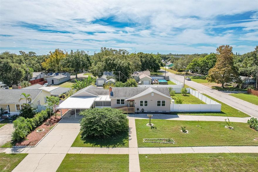 This beautiful updated 4 bedroom 2 bath home is conveniently located minutes from Downtown St. Pete, Downtown Gulfport, and the beaches! New updates have this home turnkey ready, while the elevation keeps you in a non-flood zone. Current updates include: whole home Generac generator that runs off TECO natural gas, new PGT windows & doors with warranty, whole home water filtration system, new electrical panel, new vinyl siding around the whole home, and so much more! Property features Florida friendly fruit trees and mature landscaping. Make an appointment today and sit on the patio in your backyard while watching the sunset in your new home tomorrow!