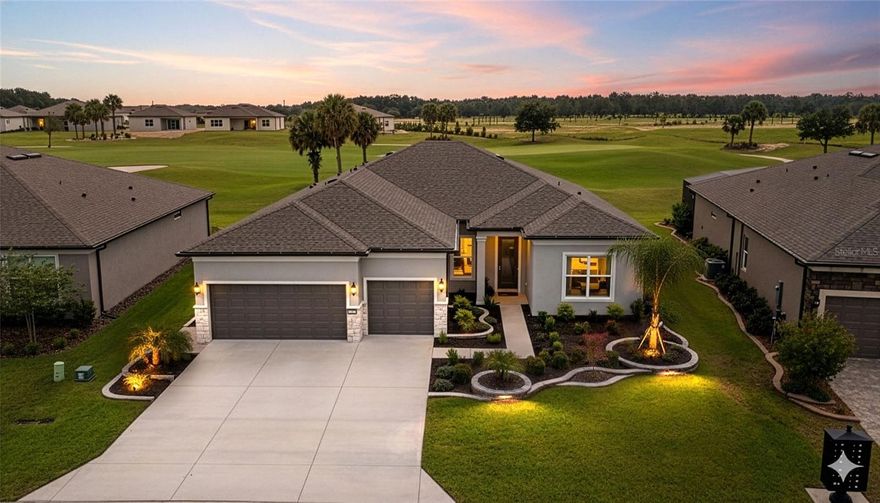 Welcome to this stunning STELLAR MODEL residence perfectly positioned on the 16TH HOLE of the Terry-Doss designed GOLF COURSE in Stone Creek, one of Ocala's most desirable 55+ gated golf community. This impeccable 2023 ECHELON SERIES blends elegance, comfort and functionality. This magnificent 3 Bedrooms, 3 Baths, plus+ Flex/Den/Office, features an exterior that effortlessly blends classic architectural charm with bold, contemporary design. Beautifully landscaped grounds with accent LED LIGHTING set the stage for this home's striking curb appeal. Stone exterior details and an elegant GLASS-INSET FRONT ENTRY creates an inviting focal point. Discover a spacious OPEN-CONCEPT design with SOARING 10'8 ft CEILINGS accented by CUSTOM CROWN MOLDINGS, PLANTATION SHUTTERS and LVP FLOORING. The Chef's kitchen showcases 42" Soft-close Wood Cabinets with pull-out drawers, Walk-in Pantry, QUARTZ counters, GRANITE UNDERMOUNT SINK, Custom Wood Canopy Hood, premium Built-in KitchenAid appliances, UNDERMOUNT LIGHTING, and a built-in BAR with wine refrigerator and display shelving adding an elegant touch for entertaining. Primary suite impresses with TRAY CEILINGS, an expansive walk-in closet, and a SPA INSPIRED BATH featuring a Roman-style shower with RAIN SHOWERHEAD and dual vanities. Guest bedroom located in the front of residence offers a PRIVATE EN SUITE. The Flex room which can be used as an Office/Den/Bonus room comes with Double French Doors for privacy.  Large laundry room features front-loading Washer/Dryer, storage cabinets and counter space. CUSTOM MOTORIZED SHADES providing a seamless indoor-outdoor living space overlooking the screened LANAI showcasing PANORAMIC GOLF COURSE VIEWS and a 25x16 BRICK PAVER PATIO. PRE-WIRED SMART HOME convenience. This home comes pre-wired as a smart home, making it easy to connect security systems, smart thermostats, lighting, and other modern features for added comfort and peace of mind. Another added feature is a whole-house WATER SOFTNER SYSTEM, ensuring fresh, purified water throughtout. Completing this exceptional property is a 3-Car Garage with a 4' Extension and EPOXY-COATING FLOORING. Prime location within the community just minutes from gatehouse, golf course, clubhouse restaurant, resort-style pools, and state of the art fitness center all within close reach. Whether by golf cart, bike, or a leisurely stroll, everything you need for an active and social lifestyle is right at your doorstep. Don't miss this opportunity to own this spectacular property. Schedule your private tour today. Check out the VIRTUAL TOUR video on the link above.