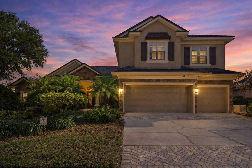 Oversized lot. Gated community. Pool + spa. Outdoor kitchen. 5 Bedrooms + Home Office + Bonus Room. Whole house generator.
And that’s just the beginning…

Step through double glass doors into a home that impresses with soaring 14-foot ceilings, rich wood floors, plantation shutters, and expansive living spaces. The formal dining room showcases elegant wainscoting and an arched window, while the grand formal living room features a gas and wood-burning fireplace and stunning views of the pool and backyard.

Designed for both everyday living and entertaining, the kitchen offers double ovens, a gas cooktop, granite countertops, abundant cabinetry, a breakfast bar, pantry, and a built-in desk area. A sunny dining space overlooks the pool—perfect for morning coffee or casual meals.

Just beyond, the family room is a true gathering space—open, spacious, and filled with natural light. Sliding glass doors lead to the lanai, creating an effortless indoor-outdoor flow for entertaining and everyday living. Whether it’s movie nights, game days, or time with family and friends, this space is made to be enjoyed.

This home offers incredible flexibility with spaces to fit your lifestyle. The bonus room is a standout with vaulted ceilings, triple windows, custom built-ins, and direct access to the pool area—perfect for a media room, game room, guest retreat, or additional living space. The dedicated home office is thoughtfully designed with multiple work areas and custom oak cabinetry, offering both functionality and style.

The primary suite is a true retreat with double door entry, bay windows overlooking the pool, two walk-in closets, and a spacious bath with dual sinks, a jetted garden tub, and a large walk-in shower. Three additional generously sized bedrooms and two full baths are located on the first floor, while upstairs features an oversized fifth bedroom with a full bath, custom built-ins, wet bar, sink, and mini fridge—ideal for a private suite or bonus living space.

*Additional highlights include a Control4 smart home system managing lighting, climate, audio, and security, a whole-house generator, and hurricane film on the windows for added peace of mind.

Step outside and experience what Florida living is all about. The oversized screened lanai is designed for both relaxing and entertaining, featuring a custom outdoor kitchen with grill, sink, mini fridge, and a beautiful wood ceiling. There’s plenty of space for outdoor dining, lounging, and hosting gatherings. The sparkling pool and spa with Pentair automation make it easy to enjoy sunny afternoons or unwind in the evenings.

Beyond the lanai, the large backyard offers privacy and peaceful views with no rear neighbors and a conservation area behind the home. Surrounded by tropical landscaping and open space, this setting creates a true escape where you can relax, play, and enjoy the outdoors.

Located in the gated Kestrel Ridge section of FishHawk Ranch, this home is zoned for highly sought-after schools including Bevis Elementary, Randall Middle, and Newsome High. FishHawk offers multiple resort-style pools, clubhouses, gyms, tennis/pickleball courts, playgrounds, skate park, sports fields, and miles of scenic walking and biking trails. Park Square brings the community together with dining, shops, and events.

This is the kind of home where memories are made—pool days and space for everyone to truly feel at home. Come see it for yourself.