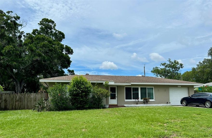 LOCATION 5 miles from Clearwater Beach - CONDITION Updated kitchen, flooring, windows - PRICE Very Reasonable. This Charming Clearwater neighborhood is a Win Win Win! Lovely 2 bedrooms, 2 full bathrooms, Living room with sliding glass doors to the 9x15 lanai or bonus room under heat & air, Ample sized Dining Room, Low Maintenance flooring installed throughout in 2022, 11x12 Screen enclosed porch, Privacy Fenced Backyard, 1 Car Garage, Majority of Windows updated in 2024 & a New Roof in 2017.