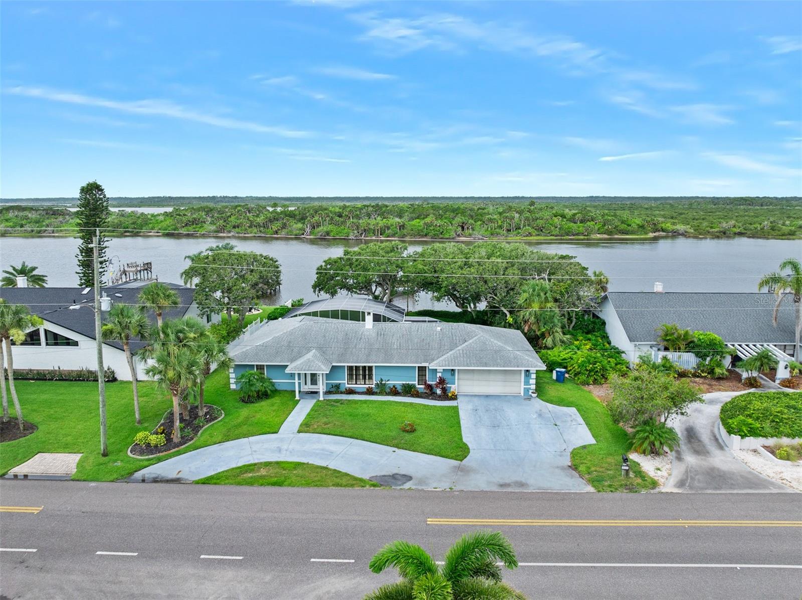 Direct Riverfront 4 bedroom, 3 bath pool home with dock priced to sell. Experience complete serenity in this waterfront setting where ancient live oaks shade the private lawn and frame the sunset show that mother nature puts on nightly. Enter this home to find an open floor plan where casual waterfront living and dining spaces are arranged around a handsome fireplace that towers beneath vaulted ceilings. The newly renovated kitchen is lovely and opens onto the family room and waterfront breakfast nook. Two of the 4 bedrooms sit directly on the water including the private guest suite with dedicated bath and separate entry to the waterfront lanai and the private owner's suite with a picture window overlooking the intracoastal waterway. Bedrooms 3 and 4 share a generous common bath. Two sliding glass doors open onto the expansive screened poolside lanai where a covered sitting area is the ideal place to relax and watch the boats go by. The sparkling blue, free form pool with spillover spa is heated and ready to be enjoyed after a day of boating. The Atlantic Ocean sits just a couple of blocks to the east where you will find a quiet, natural stretch of beach that you often have all to yourself. This property has been updated and well maintained and is ready for a new owner. Excellent Value!