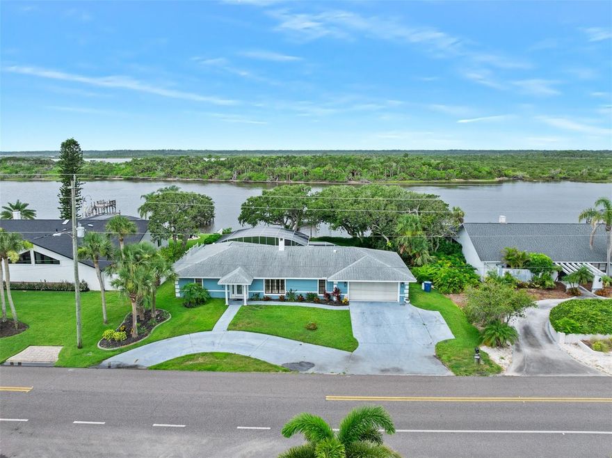 Direct Riverfront 4 bedroom, 3 bath pool home with dock priced to sell. Experience complete serenity in this waterfront setting where ancient live oaks shade the private lawn and frame the sunset show that mother nature puts on nightly. Enter this home to find an open floor plan where casual waterfront living and dining spaces are arranged around a handsome fireplace that towers beneath vaulted ceilings. The newly renovated kitchen is lovely and opens onto the family room and waterfront breakfast nook. Two of the 4 bedrooms sit directly on the water including the private guest suite with dedicated bath and separate entry to the waterfront lanai and the private owner's suite with a picture window overlooking the intracoastal waterway. Bedrooms 3 and 4 share a generous common bath.  Two sliding glass doors open onto the expansive screened poolside lanai where a covered sitting area is the ideal place to relax and watch the boats go by. The sparkling blue, free form pool with spillover spa is heated and ready to be enjoyed after a day of boating. The Atlantic Ocean sits just a couple of blocks to the east where you will find a quiet, natural stretch of beach that you often have all to yourself. This property has been updated and well maintained and is ready for a new owner. Excellent Value!