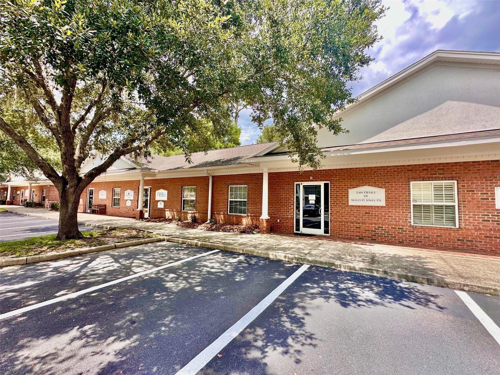 Office for sale in NW Gainesville's Metro 39 Office Park at the intersection of 43rd Street & 39th Avenue! This a great location for accessibility in Gainesville with plenty of open parking! This 1282 sq ft office features a reception area/lobby with a window/counter and door that divides the waiting area from the office space. There is an open area work space that can be partitioned into 2 or 3 work spaces and off of this main area is a conference room with windows and great natural light, a kitchen with a sink, a bathroom with a sink and 2 more private offices that front 39th Avenue, one with an exterior exit door. There is handicapped parking available and two easy entrances into the office park, one on 43rd St & one on 39th Ave. All exterior maintenance of the building is covered by the HOA. This office space has great potential for a variety of business types serving the public or administrative only. Call to schedule your showing of today!
