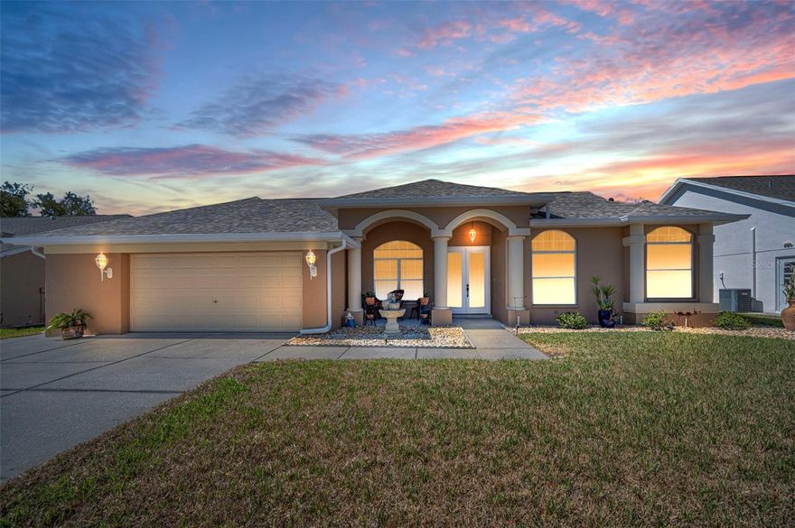 Welcome to this exceptional, move-in ready home in the highly sought-after Rosewood community of New Port Richey, where modern comfort meets peaceful Florida living. From the moment you arrive, the well-manicured landscaping and welcoming front porch create an inviting first impression that immediately feels like home. Inside, soaring ceilings and beautiful luxury vinyl flooring throughout the residence create a bright, open atmosphere that is both elegant and easy to maintain. This home has been meticulously cared for and is truly turnkey, allowing the next owner to move in and immediately begin enjoying the space without the need for updates or renovations. The kitchen features stylish stone countertops and generous preparation space, making it ideal for everyday living as well as entertaining family and guests. One of the home’s most desirable features is the private backyard setting, as the property backs to a tranquil preserve that offers peaceful views, added privacy, and a rare sense of quiet rarely found in suburban neighborhoods. The saltwater pool creates a resort-like outdoor retreat, providing a smoother and more enjoyable swimming experience while requiring less maintenance than traditional systems—perfect for relaxing afternoons or weekend gatherings. The oversized two-car garage offers excellent flexibility with room for storage, hobbies, or a workshop. Major updates such as the 2021 roof and recent exterior painting provide additional peace of mind for buyers seeking a well-maintained property. The location further enhances the home’s appeal, with the River Ridge Middle and High School campus just a short walk away, making daily routines easy and convenient. Residents also benefit from quick access to the Veterans Expressway and the newly completed Ridge Road extension connecting to the Suncoast Parkway, allowing for smooth travel throughout the Tampa Bay area, including Tampa International Airport, beautiful Gulf beaches, shopping, dining, and major healthcare centers. Positioned in FEMA Flood Zone X, the property also benefits from lower flood insurance risk compared to many nearby homes. With its combination of thoughtful updates, peaceful preserve views, and convenient access to everything Tampa Bay has to show, this home presents a rare opportunity to enjoy comfortable Florida living in one of the area’s most desirable neighborhoods.