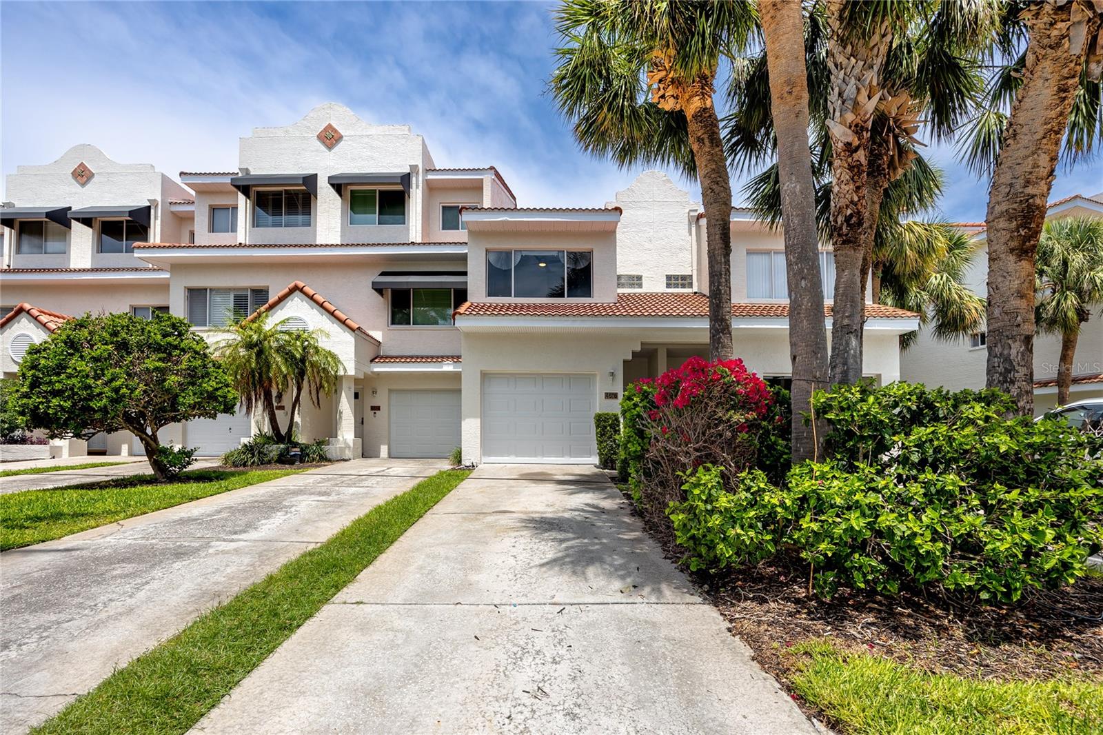 ***SEASONAL RENTAL *** Available for rent now through the end of October, 2025*** in the charming Mirabella Court community, this two-bedroom, two-and-a-half-bath garden-view townhouse offers a fantastic opportunity to enjoy the Florida lifestyle just steps from the award-winning sands of St. Pete Beach. Located in a quiet, planned neighborhood along Boca Ciega Bay, residents enjoy access to a sparkling heated pool, private fishing dock, and beautifully maintained landscaping—all cared for by the HOA. This pet-friendly community welcomes up to two large pets and requires a minimum three-month lease. The home features an open-concept layout on the main floor, ideal for entertaining or relaxing, with a kitchen, dining, and living area that flows out to a private backyard patio—perfect for grilling or enjoying warm evenings. The lower level includes a spacious one-car garage. Upstairs, the primary bedroom offers an ensuite bath, a generous walk-in closet, and plenty of space for a sitting area. The second bedroom is well-suited for guests or a home office, with a full bath conveniently located just outside the door. The washer and dryer are also located on the second floor for added convenience. Located close to local dining, vibrant downtown St. Petersburg, Fort De Soto Park, and just a short drive from Tampa International and St. Pete/Clearwater airports, this rental puts you at the center of everything. Application fee of $65/person over the age of 18 is required. Upon approval, a $100 tenant processing fee, $300 cleaning fee, $2500 security deposit, and $50 condo application fee is due. Short term rentals (6 months or shorter) will incur a 13% sales & tourism tax.