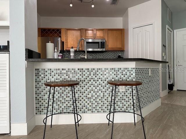 Photo of 6159 Metrowest Boulevard #108, Orlando, FL 32835 (MLS # O6446034)