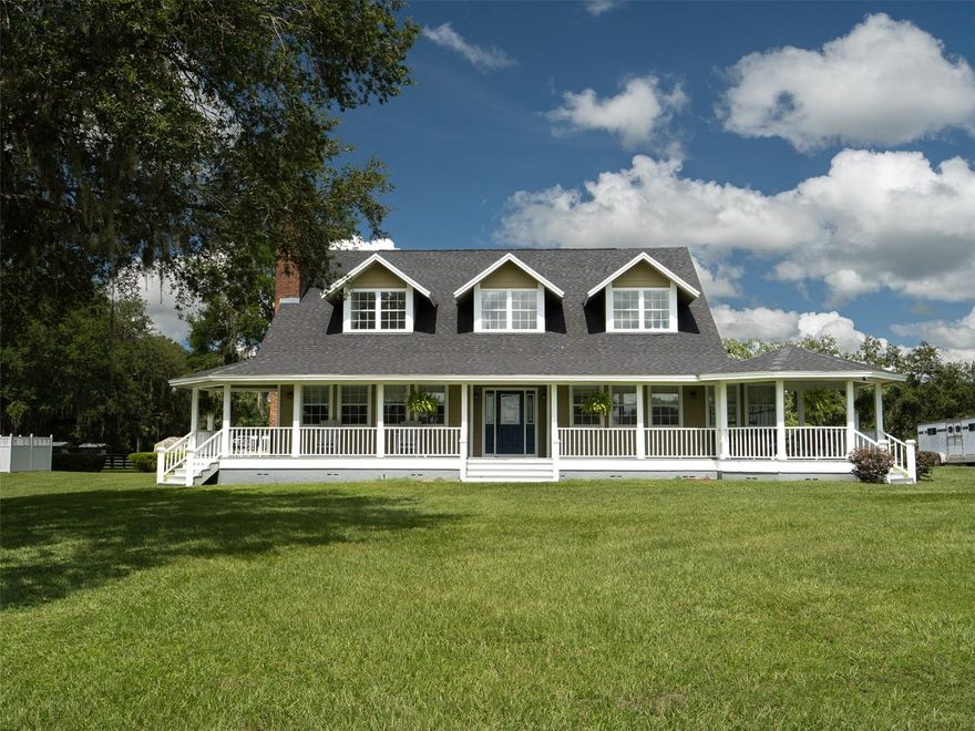 Ideally located in the heart of Marion County’s acclaimed horse country, this nearly 40-acre farm offers an unbeatable combination of rural charm and proximity to premier equestrian venues! Just 15 minutes from the World Equestrian Center (WEC) and 12 minutes to HITS, this property is perfectly positioned for equestrians looking to train, compete, or operate within one of the top horse communities in the country! Fully fenced and gated, this farm is well-equipped for a variety of disciplines. The layout includes eight paddocks, a round pen, a eurosizer, and multiple barns offering a total of 23 stalls, including dedicated foaling stalls, with the main barn featuring a center-aisle design, wash rack, and ample feed and tack storage. Four large fields are each outfitted with run-in sheds, automatic waterers, and water misters, providing optimal comfort and care for your horses year-round. There is also a very nice dog kennel on the property, offering additional functionality for dog owners or breeders. Additional accommodations include a separate barn apartment, perfect for a farm manager or seasonal rental, featuring 3 bedrooms, 1 bathroom, and full kitchen, dining, and living areas. This property offers ample room to add an arena, jump field, or other training facilities to suit your vision. At the center of the farm is a beautifully maintained country-style home surrounded by mature landscaping and a large wrapping porch. With over 3,000 sq ft of light-filled living space, the 4-bedroom, 3.5-bath residence boasts cathedral ceilings, wood and tile flooring, and expansive windows framing panoramic farm views. The living area features a striking floor-to-ceiling gas fireplace, while the spacious kitchen includes stainless steel appliances, a center island with cooktop and vent hood, generous cabinetry, and a breakfast nook with bay windows. The master suite includes a large walk-in closet and en-suite bath with dual vanities, a walk-in shower, and a garden tub. A former attached garage has been converted into a self-contained studio apartment with a full kitchen, offering flexible options for guests or additional living space. Out back, enjoy the in-ground pool surrounded by mature hedging and overlooked by the home’s rear porch. Whether you're a serious competitor, a breeder, or simply seeking a peaceful and scenic equestrian lifestyle with world-class facilities just around the corner, this property delivers the best of both convenience and countryside elegance.