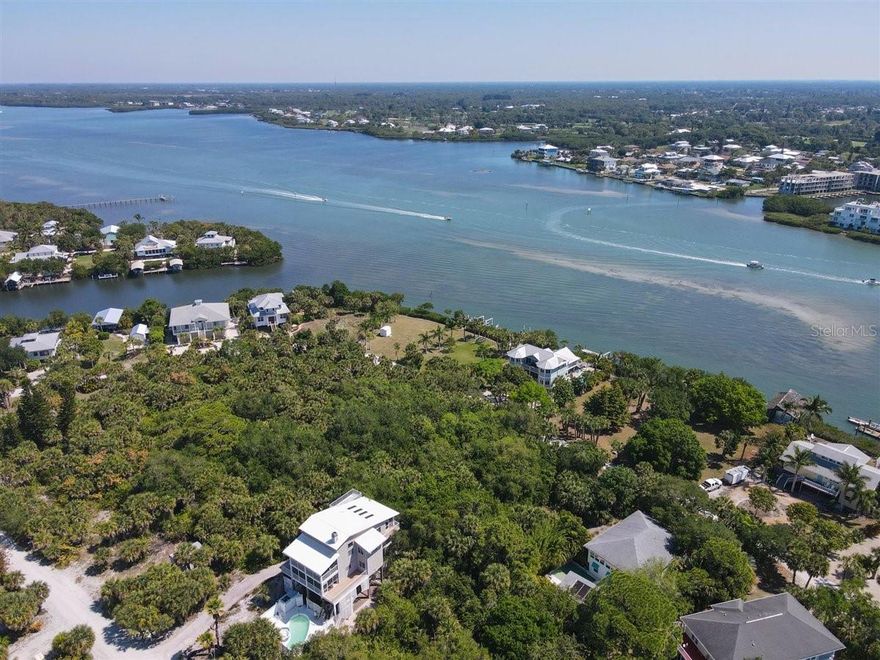 Dreaming of Island Life in The Sunshine State!? This ideally located lot will offer both canal/bay & gulf views once you build your new island home. A quick golf cart ride will lead you to 7 miles of pristine beaches where you can enjoy the day in the sunshine. “Palm Island” is a tropical paradise along the Gulf of Mexico, reminiscent of “Old Florida” where nature and tranquility abound. This bridgeless barrier island is accessible only by boat or car ferry (approx. 3-minute ride!) and offers all the modern conveniences you expect and deserve. Rum Bay Restaurant and a small resort shop are located on the Island at the Palm Island Resort that islanders may enjoy. World class fishing, boating, shelling, and gorgeous sunsets are enjoyed & appreciated on a daily basis…a life that feels like a vacation all year round. Plus, transportation by golf cart or bicycle is the norm. The Island includes: Knight Island (the most northern island bordered to the north by Stump Pass), Don Pedro island (the “middle” island), and Little Gasparilla island, the most southern island. Don Pedro Island State Park which is approximately 135 acres of natural pristine land is accessible by boat or beach walk (restrooms available).