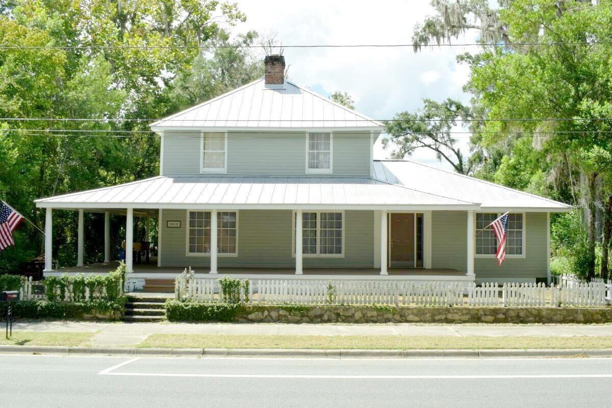 Welcome to a true piece of Historic Florida! Come find a beautifully renovated home where timeless character blends seamlessly with modern comfort.
This spacious residence has been thoughtfully updated with major improvements, including a new commercial-grade metal roof (2019) and dual AC units (2019), updated electrical and plumbing, and stainless steel appliances in a chef-inspired galley kitchen. The kitchen is designed for culinary creativity, offering both style and functionality with a stunning view of the open Florida skies.
Step inside and you’ll find warm hardwood floors, detailed crown molding, and a layout that flows effortlessly. The stunning master bathroom is a true retreat, featuring spa-like finishes that invite you to unwind.
Outside, enjoy a fully fenced yard perfect for pets, gatherings, or simply soaking up the Florida sunshine. Despite its generous size and upgrades, the home maintains a low utility bill thanks to its efficiency.
Best of all, the home is located just 0.4 miles from the charming shops, dining, and historic beauty of downtown High Springs. Property is zoned C2 - mixed use. Currently set up for residential living but can easily be converted for office space or a Bed and Breakfast.