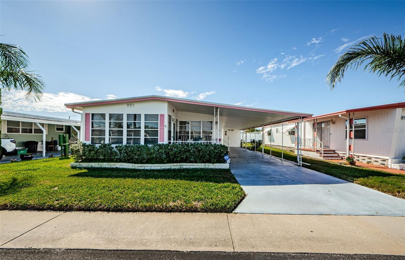 NEW PRICE! Move-In Ready & Fully Furnished (Optional) This beautifully maintained 2-bedroom, 2-bath double-wide home is located in the highly sought-after Tarpon Shores 55+ community, where you own the land! The $40K share price is included in the list price and can be financed through the HOA. *NO FLOOD OR WIND DAMAGE!* Enjoy a spacious 2-car carport with a long driveway that can accommodate up to 3 vehicles. The private backyard has no rear neighbors, providing a peaceful and serene setting.
Inside, the fully equipped kitchen includes all appliances, plus a newer full-size stackable washer and dryer conveniently located in the kitchen closet. Relax and unwind on the front-covered porch or in the enclosed Florida Room, both ideal for entertaining or enjoying your morning coffee. The primary suite features a walk-in closet and an en suite bath with a step-in shower, while the guest bath offers dual sinks and a step-in shower with grab bars. Ceiling fans in the primary bedroom, second bedroom, and Florida Room help keep the home comfortable year-round.
This home has been well cared for and includes recent upgrades, such as a NEW ROOF (2019), AC system (2022), new electrical panel (2023), and a new water heater (2023). The property also features a well-water irrigation system.
Live like you’re on vacation year-round in this friendly and vibrant community, offering a large clubhouse with a kitchen, library, and billiard room, a heated pool with BBQ grills, and a variety of outdoor amenities, including pickleball, bocce ball, shuffleboard, and horseshoe pits. With organized social activities, there’s always something to enjoy.
The low monthly HOA fee of just $315 a month covers lawn mowing, lawn spraying (fertilizer, insecticide, and weed control), water, sewer, trash pickup, cable TV (with a park information channel), and Internet. Located minutes from beaches, golf courses, walking trails, fishing, shopping, fine dining, and breathtaking sunsets, Tarpon Shores offers low HOA fees, low taxes, and is NOT in a flood hazard zone. This is an incredible opportunity—don’t wait! Schedule your private showing today!