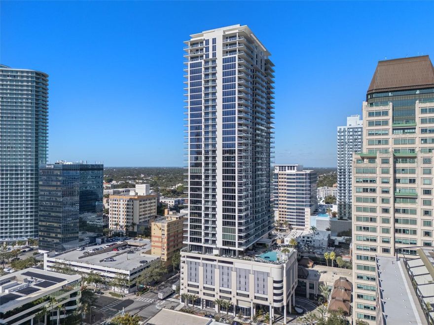 One or more photo(s) has been virtually staged. Where local art meets luxury living in the heart of thriving downtown St. Petersburg, this exceptional Art House "Artisan" floor plan offers 3 bedrooms, 3.5 baths and panoramic water views spanning Tampa Bay to the Gulf of Mexico to Boca Ciega Bay and beyond. This sophisticated northwest corner residence features 359 square feet of premium outdoor terrace space perfectly positioned to capture iconic Gulf Coast sunsets and refreshing Sunshine City breezes without intense southern heat exposure. Floor-to-ceiling sliders in both the expansive great room and luxurious primary bedroom frame breathtaking views while connecting you seamlessly to indoor-outdoor Florida lifestyle living. The gourmet chef's kitchen showcases striking quartz waterfall countertops, sleek European cabinetry and premium stainless-steel Jenn-Air appliances. All three generously sized bedrooms feature private ensuite bathrooms, while the spa-inspired primary suite elevates luxury with dual walk-in closets, elegant double-sink vanity and indulgent rainfall shower. Art House sets the standard for upscale St. Petersburg condominium living with resort-style amenities including heated pool and spa, state-of-the-art fitness center, steam room, dry sauna, private theatre, swing sports simulator, club room with private dining, dog park, guest suites and concierge service. Positioned in the epicenter of St. Petersburg's cultural renaissance surrounded by acclaimed restaurants, museums, waterfront parks and endless entertainment, this is luxury urban living at its finest. Contact me today for your exclusive private showing!