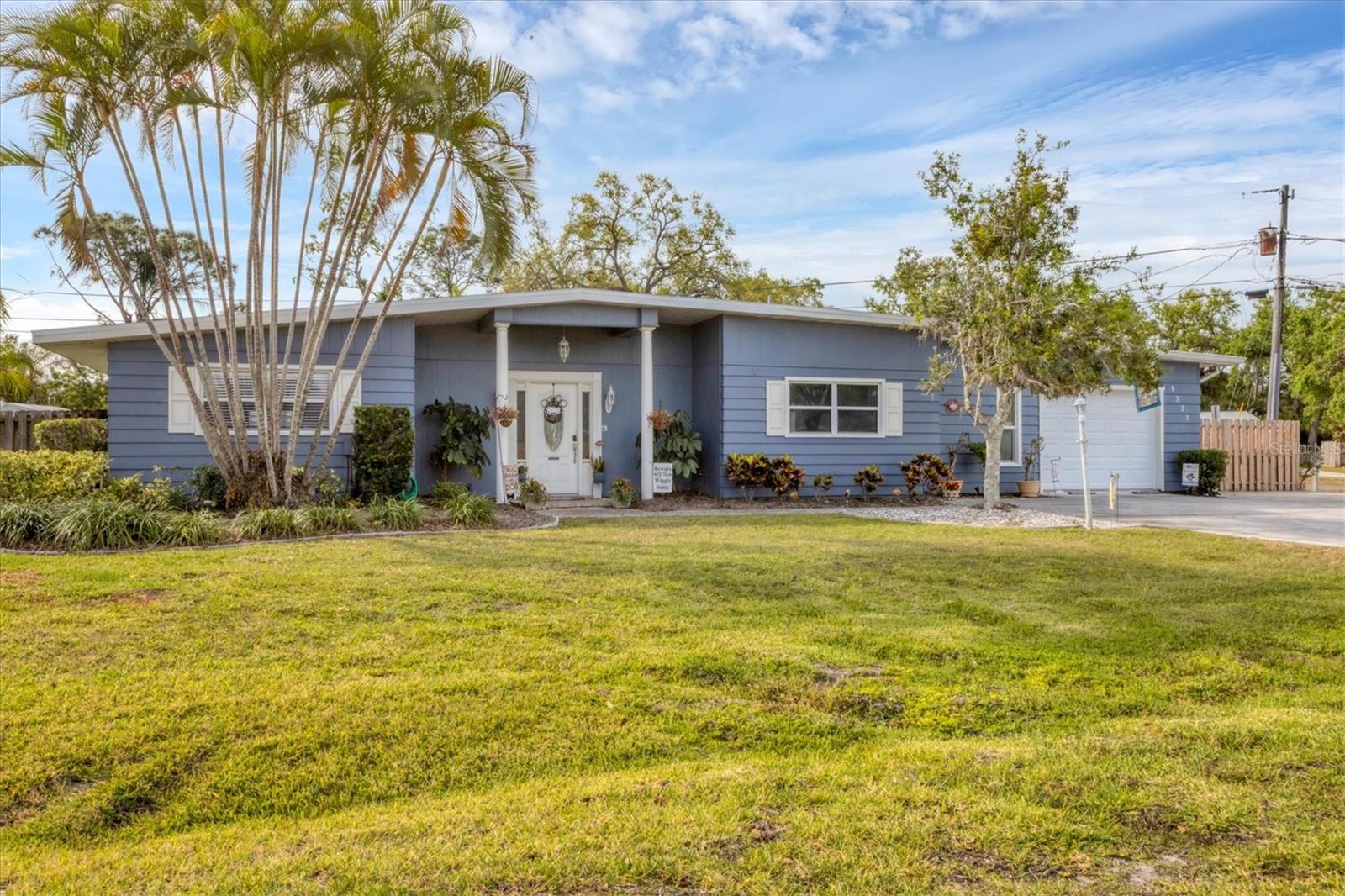 SELLER OFFERS A $5000 BUYER CREDIT TOWARD CLOSING COST AND PREFERRED LENDER COLONIAL MORTGAGE IS OFFERING NO UNDERWRITING FEE AND A FREE APPRAISAL UPON CLOSING. Incredible Value on this beautifully updated home with NO HOA!! Don’t miss your chance! 3-bedroom, 2-bath heated pool home on an oversized corner lot. Packed with curb appeal and practical upgrades, this Sarasota gem features a huge fenced yard, 30-amp RV hookup, and a long list of improvements: New roof (2021) New garage door (2024) Fresh exterior paint (2025) Interior paint (2020) New refrigerator (2023) Updated electrical & plumbing (2014) Step inside to find a bright, welcoming layout with a spacious living room and gas fireplace, formal dining area, and large eat-in kitchen offering solid surface counters, bar seating, and an instant hot water dispenser. Enjoy privacy with a split-bedroom floor plan, and take advantage of the garage under A/C—perfect as a 4th bedroom, office, or flex space. Outside is your very own Florida retreat featuring a heated pool, brick paver patio, covered lanai, and lush tropical landscaping. The fully fenced backyard is ideal for pets and includes a dog run, two storage sheds, and ample driveway parking. Located in a quiet, pet-friendly neighborhood, you’re just minutes from shopping, dining, and everything Sarasota and Bradenton have to offer. This is chance—don’t let it slip away! Schedule your private showing today - this one is priced to move!