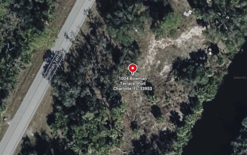 Photo of 1004 Bowman Terrace, Port Charlotte, FL 33953 (MLS # C7519486)