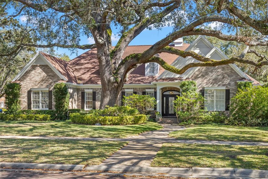 Welcome to perfection in Golf View! This estate boasts .49 acres on a corner lot just steps away from Palma Ceia golf course. Beautiful grand oaks surround this brick home on one of Tampa’s most distinguished neighborhoods. Pride of ownership can be found around every corner.  The moment you walk thru the front door of this smart home you will notice the fine modern touches, gorgeous original oak wood floors, a stone encased gas fireplace, a spacious open floor plan and gourmet kitchen. The kitchen is highlighted with a quartz center island, stainless appliances including a double oven, warming drawer, and designer soft touch cabinets. The Primary bedroom of this split plan is spacious with custom built ins, the oversized primary bath has a dual head rain shower, soaking tub, and marble tile flooring. Walk into the massive closet to find anyone's dream closet. It is the epitome of opulence with custom shelving and built ins throughout. In between the kitchen and downstairs ensuite bedrooms you will find why this home is perfect for entertaining. The butler's pantry is a functional second kitchen; equipped with all custom cabinet paneled dishwasher, ice maker, refrigerator and freezer. The quartzite wraps the entirety of the butler's pantry and has a full run backsplash and under cabinet lighting.
The entire space has brushed gold finishes and a state-of-the-art double wall oven and stackable washer and dryer. Upstairs you will find an incredible sheik bonus room that can be converted into two bedrooms or left as an entertainment room fully functional with wet bar and full bath.
Step outside to your own pool paradise. Luxurious pool decking and an in-ground pool with a separate in ground jacuzzi by Holloway Pools. Across from the pool French doors lead you to Ritz Carlton like spa. Enjoy and relax with a custom dry sauna and steam shower. Use as a workout area/office/in law suite with a built in 300 bottle wine refrigeration unit and sink/refrigerator and full bath.