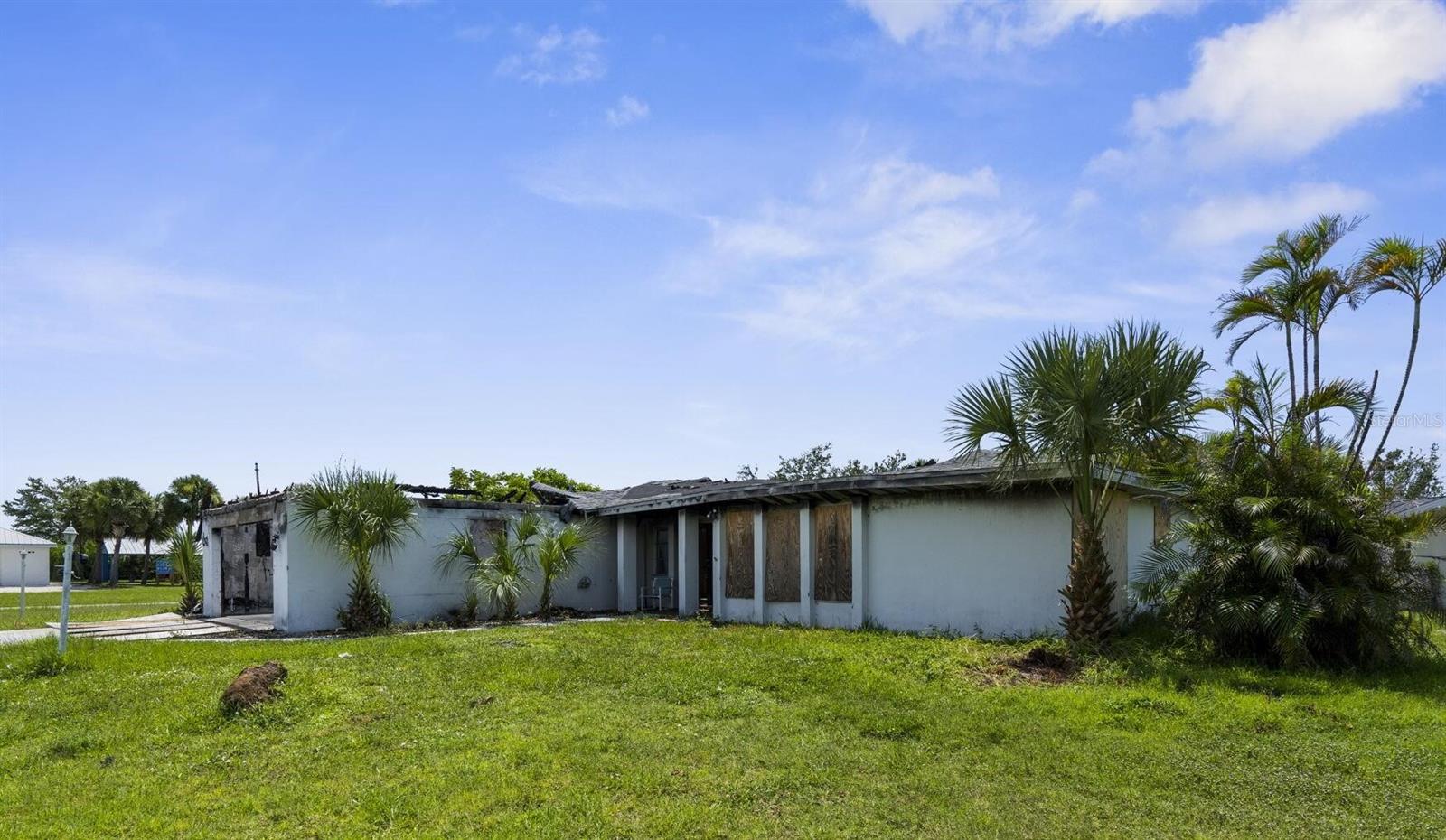 Welcome to 189 Cummins Avenue in sunny Port Charlotte! This expansive 3-bedroom, 3-bathroom pool home has over 2,100 sq ft of space ready to be reimagined.
Yes, this property has experienced fire damage, but don’t let that stop you—this is your chance to unlock incredible value and create something truly special.
Imagine transforming the generous floor plan into a modern showplace, relaxing by your private pool, and enjoying life just minutes from shopping, dining, schools, and the beautiful Gulf beaches.
Opportunities like this don’t come around often—bring your creativity, your contractor, and your dreams!