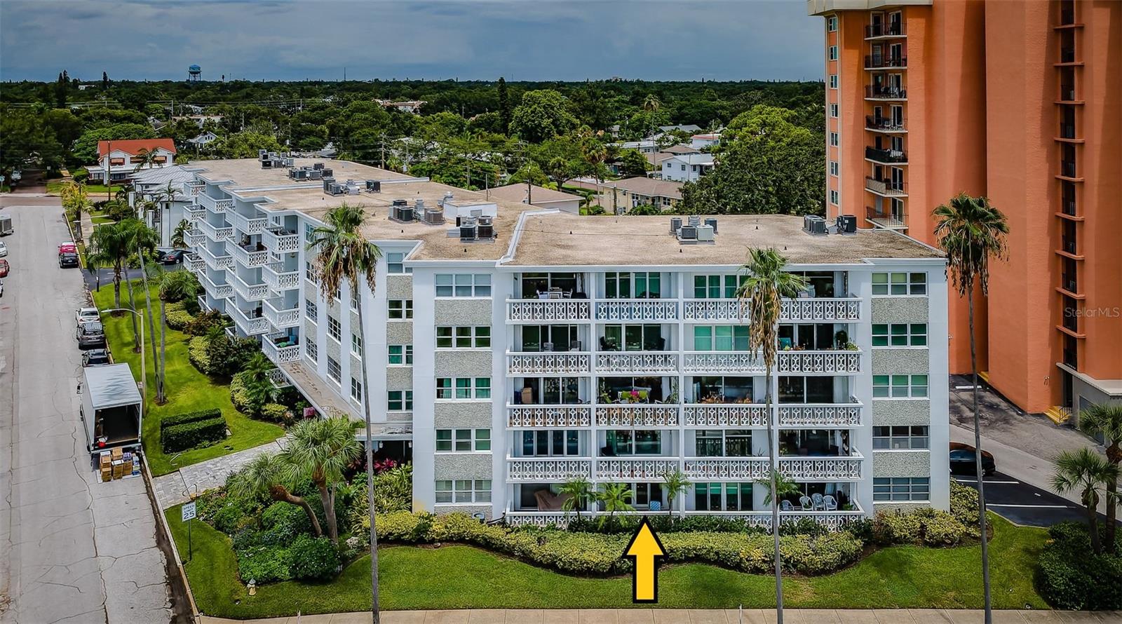 Not age restricted and not in a flood zone, the incredible location of this condo enables you to walk across the street to the waterfront park, to all the entertainment events at Vinoy Park, to the olympic-sized public pool and tennis courts, and to all the shopping and nightlife in downtown St Pete! A wall of impact sliding doors in both the living room and master bedroom provide an awesome view of Tampa Bay. Both the master bedroom and living room have patios facing Tampa Bay. Neutral tile floors throughout and HVAC are newer improvements. Two storage closets are right outside your entry door. You have the opportunity to update the interior of this two bedroom, two bath condo to your own design preferences and a covered parking space will protect your vehicle from the Florida sun and rain. This location is right at the edge of the Old Northeast Historic District with many of Florida's many charming period homes. Convenient to Tampa International Airport, shopping, restauants, beaches, hospitals and entertainment, this location is a winner!