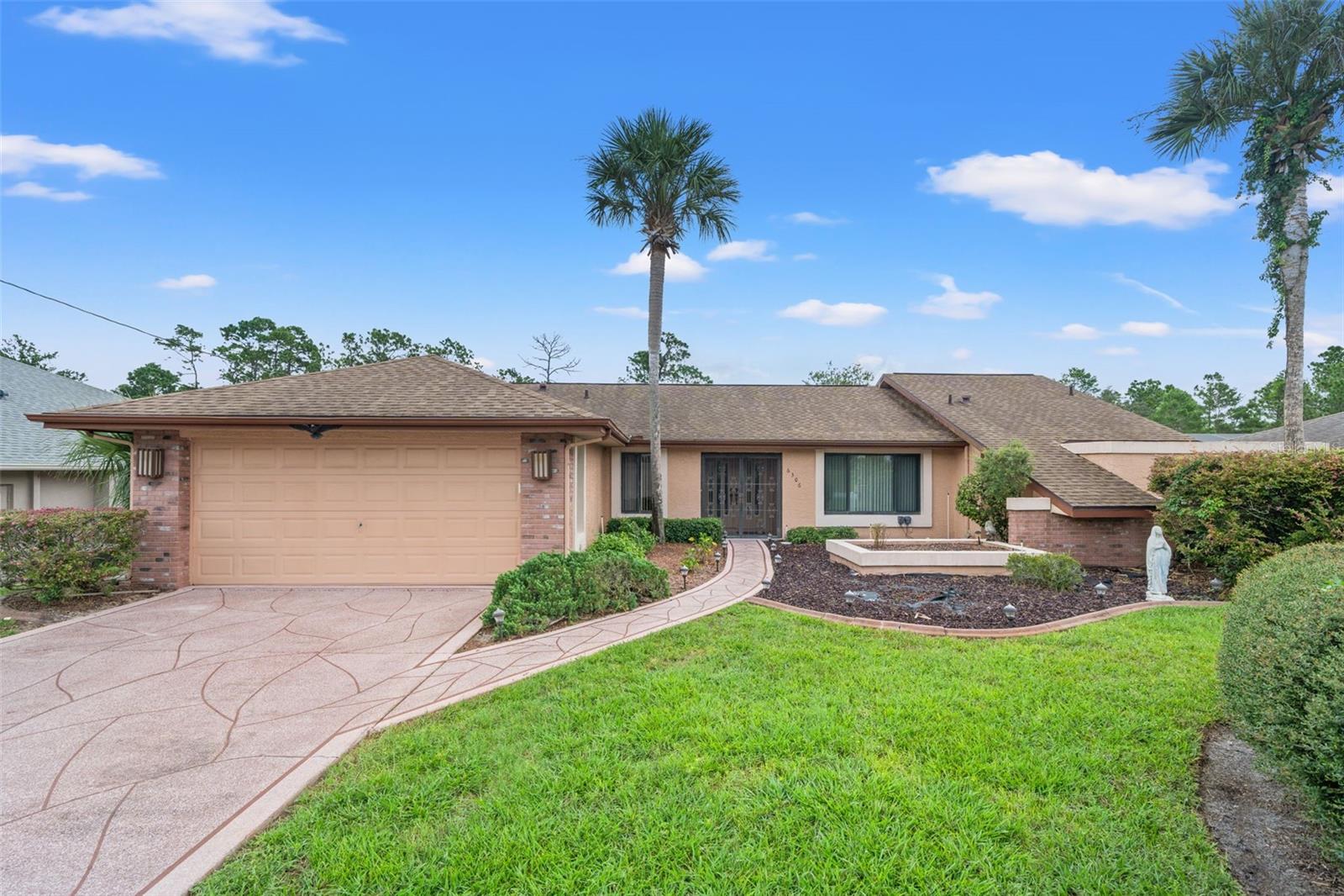 Elegant Pool Home in Spring Hill – No HOA, No CDD. Welcome to a stunning blend of style, comfort, and Florida living in this beautifully maintained 3-bedroom, 2-bathroom residence offering 1,932 square feet of living space and a total of 2,730 square feet under roof. Situated in a peaceful Spring Hill neighborhood, this home impresses from the moment you arrive with its inviting curb appeal, manicured landscaping, and timeless exterior design. Inside, soaring ceilings and an abundance of natural light create an open, airy atmosphere. The spacious living and dining areas flow seamlessly into a well-appointed kitchen featuring modern appliances, generous cabinetry, and a breakfast bar ideal for casual gatherings. The split-bedroom layout ensures privacy, with the primary suite serving as a tranquil retreat complete with a walk-in closet, dual vanities, a soaking tub, and a separate walk-in shower. Step through sliding glass doors to an outdoor paradise. The expansive screen-enclosed pool and covered lanai offer the perfect setting for morning swims, afternoon lounging, or evening entertaining. Behind the property lies a serene, natural backdrop that is protected from future development, ensuring lasting privacy and an uninterrupted view. Meticulously cared for and reroofed in 2019, this home offers peace of mind and is completely free from HOA and CDD restrictions. The property also features a recently replaced A/C system. Move-in ready and designed for both everyday living and unforgettable entertaining, this is more than just a home—it’s your personal Florida oasis.