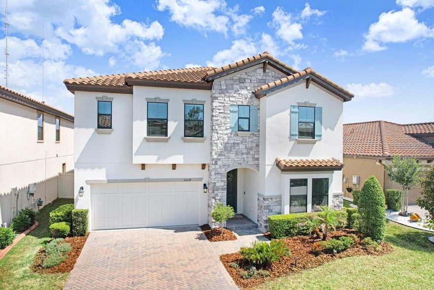 Welcome to this stunning home in a gated community within the highly sought-after A-rated FishHawk school district, where luxury meets functionality. The chef-inspired kitchen features a gas cooktop, wall oven with built-in microwave, stainless steel hood, expansive island, walk-in pantry, and elegant white cabinetry with gold hardware. A thoughtfully designed floor plan offers a downstairs bedroom and full bath—ideal for guests or multi-generational living—along with a spacious office and versatile hidden nook perfect for a reading retreat, art studio, or butler’s pantry. Upstairs includes a generous primary suite with a large walk-in closet, three additional bedrooms, a well-appointed guest bath with dual sinks and private lockout shower area, and a massive loft ideal for a second living space or media room, plus an oversized laundry room. Step outside to a fully fenced PVC backyard with a sprawling 550 sq ft paver patio—perfect for entertaining. Built just 5 years ago, this home offers low-maintenance living and peace of mind, with no CDD, low HOA fees, and a prime location near shopping, dining, and everyday amenities.