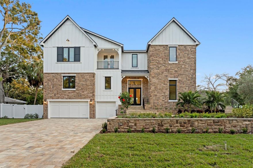 Brand new construction on a rare 120x150 double lot in Sunset Park - space to stretch out, entertain, and truly live. This transitional luxury home by Adobe Homes balances design and comfort beautifully, with soaring ceilings, walls of windows, and tranquil greenery views that set a calm backdrop for everyday life. The dramatic tiered front and backyard showcase the expansiveness of the 18,000+ SF property.

The heart of the home is a magazine-worthy kitchen featuring a dramatic double-island layout, Wolf/Sub-Zero appliances, quartz counters, picture-frame windows, and a stunning butler's pantry. Multiple flexible living spaces offer room for everyone: a private first-floor guest suite tucked away for comfort and privacy, a dedicated office with its own terrace, a loft and upstairs bonus room with wet bar ideal for media, play, or fitness, and an elevated theater/bonus level that's quiet and separate for focused use.

The primary suite feels like its own retreat with a private balcony overlooking the resort-style backyard, a spa-inspired wet room with soaking tub and rain shower, and a massive closet. Outside is where this home truly stands apart - a huge pool and spillover spa with automatic floor cleaners, expansive pool deck, wide green lawn, lush privacy landscaping, and a covered lanai with gas fireplace and outdoor kitchen, all surrounded by mature trees.

Additional notable features include impact-rated windows and doors, a built-in elevator shaft, custom millwork, smooth drywall, wide-plank flooring, smart wiring, and a three-car garage with epoxy floors. Move-in ready and perfectly located within short walking distance to Mabry, Coleman, and St. Mary's, and zoned for Plant High School.

4624 W. San Jose St - where elevated luxury meets everyday living. Welcome home.