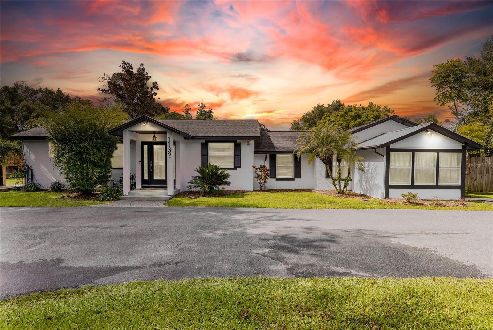 This updated home sits on an oversized lot in the Belle Isle area of Orlando with many custom features throughout. The lot has lush dense trees and plants that provide privacy on nearly 3/4 acres while still located in the middle of everything! The dream kitchen features many custom touches including range hood, large gas range, huge refrigerator/freezer, massive center island, solid surface countertops, plenty of cabinets and drawers, vaulted ceilings, and adjoining dining room with view of the backyard. Wood look tile and luxury vinyl planks are throughout the home. There are custom built-ins, decorative beams and custom wood trim. Outside there is a separate office space with a half bath and a cozy porch. The giant custom treehouse with deck comes equipped with electric and a/c. The circular driveway adds safety, convenience and extra parking. The 16 x 24 barn with 16' ceilings provides you with additional storage and the fenced in side yard has a double gate for easy access. The Randolph public boat ramp is less than a block away with access to the Conway Chain of Lakes. The home is located minutes from the airport, major highways, shopping and restaurants, downtown Orlando and SODO.
