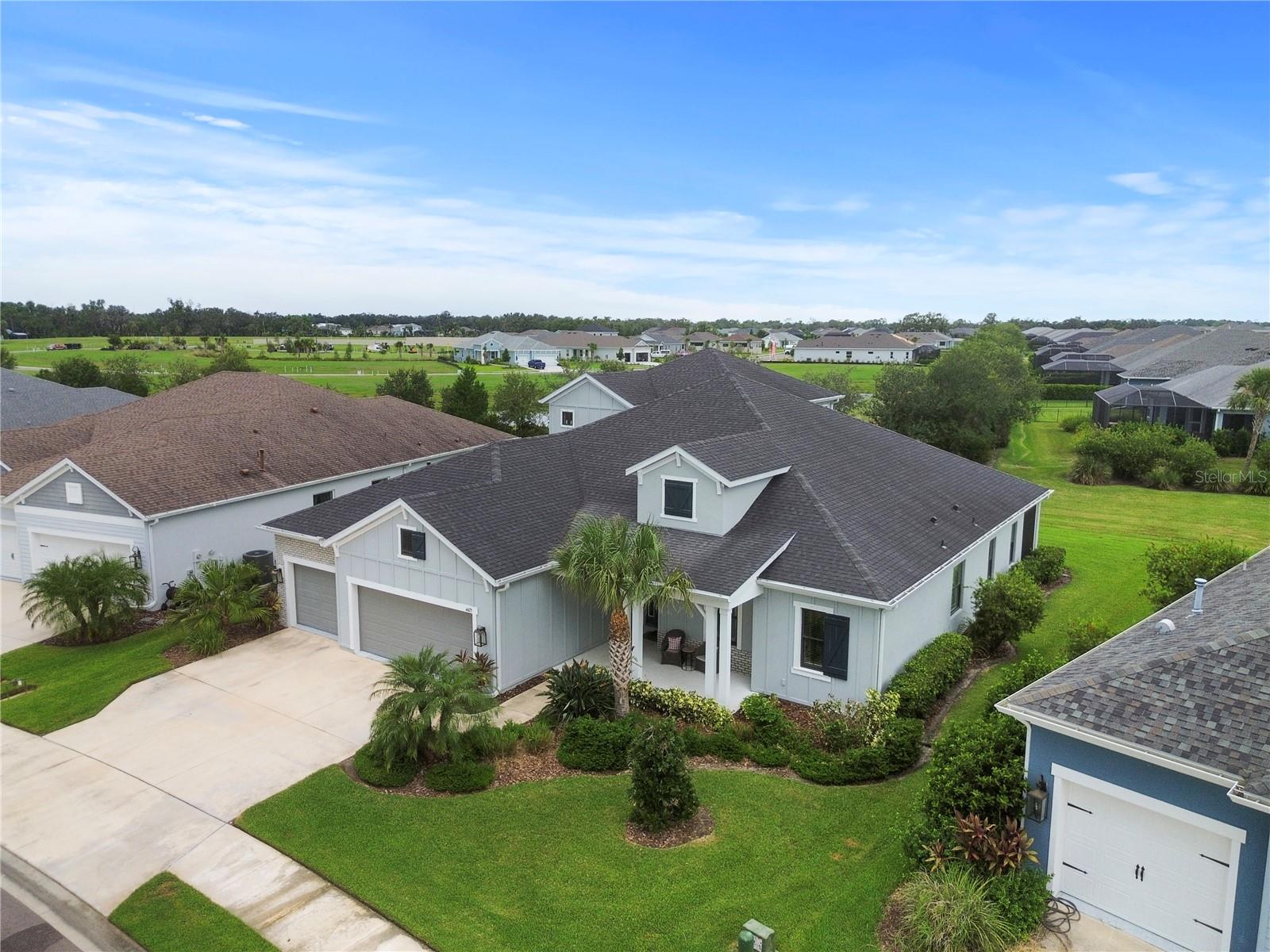 2.75% INTEREST RATE w/ASSUMABLE VA loan. Massive Home in Canoe Creek. The largest floor plan available boast 5 bedrooms, 4 full bathrooms, a den, a HUGE Bonus room upstairs and over 3,700 sf. Also enjoy that it has a 3 car garage, a huge lanai and is located in one of Parrish's premier amenity rich communities, Canoe Creek. Fantastic curb appeal with washed brick trim, a large front porch. Welcoming foyer meets the enormous great room. Everything about this home is oversized. Gourmet Kitchen with extended island for plenty of eating. Sliders all across the back let in light accent the Green views and connect the lanai space. Stainless steel appliances, gas cook top, built in oven, stone counters.
4 bedrooms on the first floor. 1 bedroom, 1 bath, and bonus room on the second floor. Great space for guest room or media, game room. Master bedroom is extremely large and the closet is the size of a small bedroom. Dual vanities, walk in shower. Gorgeous tile work through out bathrooms, perhaps the largest laundry room you have ever seen. The amenities in Canoe Creek are top notch. Feels like you are on vacation when you step into the resort style pool, spa, firepit, sport courts, workout center, and gorgeous clubhouse. Definitely need to see this one!