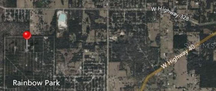 Build your future in the growing community of Rainbow Park in Ocala. This vacant lot presents an excellent opportunity for builders, investors, or buyers ready to design a custom home in one of the area’s expanding locations. Conveniently situated near shopping, dining, parks, and the World Equestrian Center, this property offers both flexibility and potential with no HOA restrictions.