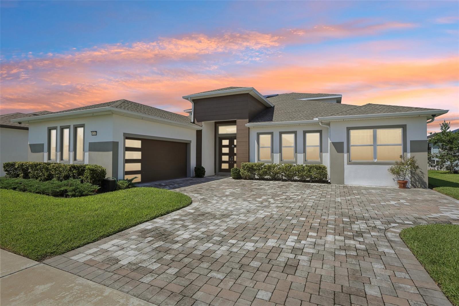 One or more photo(s) has been virtually staged. STUNNING WATERFRONT HOME in exclusive gated community! This exceptional 6BR/4BA residence sits on one of the most desirable water-view lots in this 80-home enclave. Open floor plan showcases a gourmet kitchen with upgraded Thermador appliances (range, oven, microwave, dishwasher), stone counters, wall oven, extended cabinetry with coffee/wine station, and buffet bar perfect for entertaining.
First-floor primary suite features water views, a large walk-in closet, and a spa-like ensuite with dual sinks and a huge walk-in shower. Three additional bedrooms with walk-in closets are also on the main level. BONUS: Private in-law suite with kitchenette - perfect for multi-generational living or rental income.
Upstairs loft connects two more bedrooms and a bath, plus a media room with a projector screen and balcony overlooking nature with no backyard neighbors.
PREMIUM UPGRADES: 29KW solar panels, whole-home water softener/distilled water system, Cat 6 cabling throughout, 30 premium speakers with 3 subwoofers, mosquito mist system, custom cabinetry in mud room/laundry/office, luxury vinyl plank main level with carpet upstairs, complete gutter system, garage with Floortex Polyaspartic coating, overhead storage racks, slat walls, and bike racks. Home warranty through 2027 included.
Covered paver patio with serene water views. VASTU COMPLIANT: Thoughtfully oriented to promote well-being, prosperity, and harmonious living. The Epperson community offers lagoon access with 7 acres of crystal-clear water, a swim-up bar, kayaking, paddleboarding, cabanas, live music, golf cart parades, top-rated schools, and included high-speed internet. Minutes from shopping/dining, 35 minutes to Tampa International Airport. KEY FEATURES
*Gated waterfront community*
Open floor plan*
Gourmet kitchen with Thermador appliances*
First floor primary suite*
In-law suite with kitchenette*
Media room with projector*
29KW owned solar system*
Premium sound system (30 speakers/3 subs)*
Whole-home water treatment*
Professional garage organization system*
No backyard neighbors*
Resort-style community amenities*
Home warranty included through 2027*- See attached floor plans and documents.