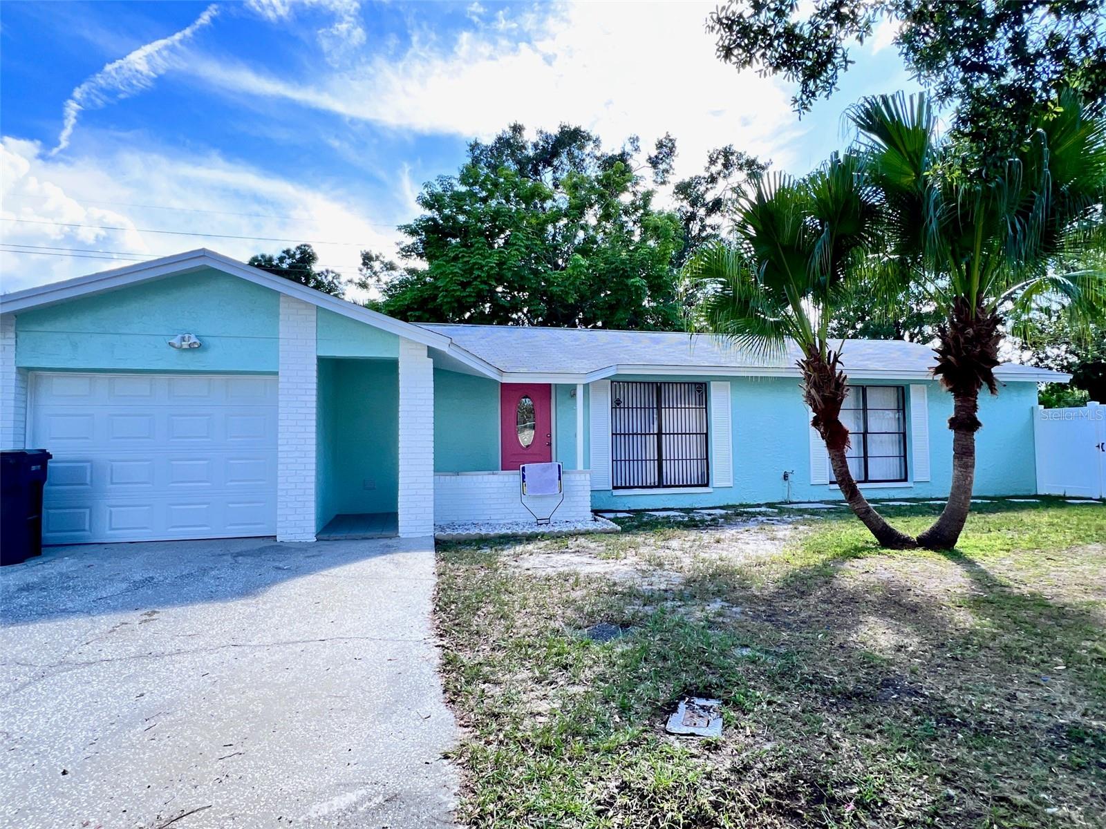 This beautifully updated single-family home offers 3 bedrooms, 2 bathrooms, and a 1-car garage in a quiet, established Timberlane neighborhood. Enjoy the enclosed screened porch, a spacious private fenced backyard perfect for entertaining, room for children to play, and a storage shed. A side yard entrance allows a boat or truck to park behind a private fence. Modern upgrades make this home move-in-ready: new vinyl plank flooring, a new air conditioner, water heater, stainless steel appliances, new bathroom vanities, ceiling fans, light fixtures, window blinds, and fresh neutral interior and exterior paint. The generous 1,248 sq ft open floor plan features a split bedroom design. The primary suite bedroom offers two double closets, a private sitting area perfect for makeup application, and a walk-in shower. The second bathroom includes a tub for soaking and relaxation. A smaller fourth room works perfectly as an office or playroom. Laundry is conveniently located in the garage. The prime location is just minutes from Tampa International Airport, Raymond James Stadium, International Mall & Bay Street, and upscale dining, shopping, and hospitals.