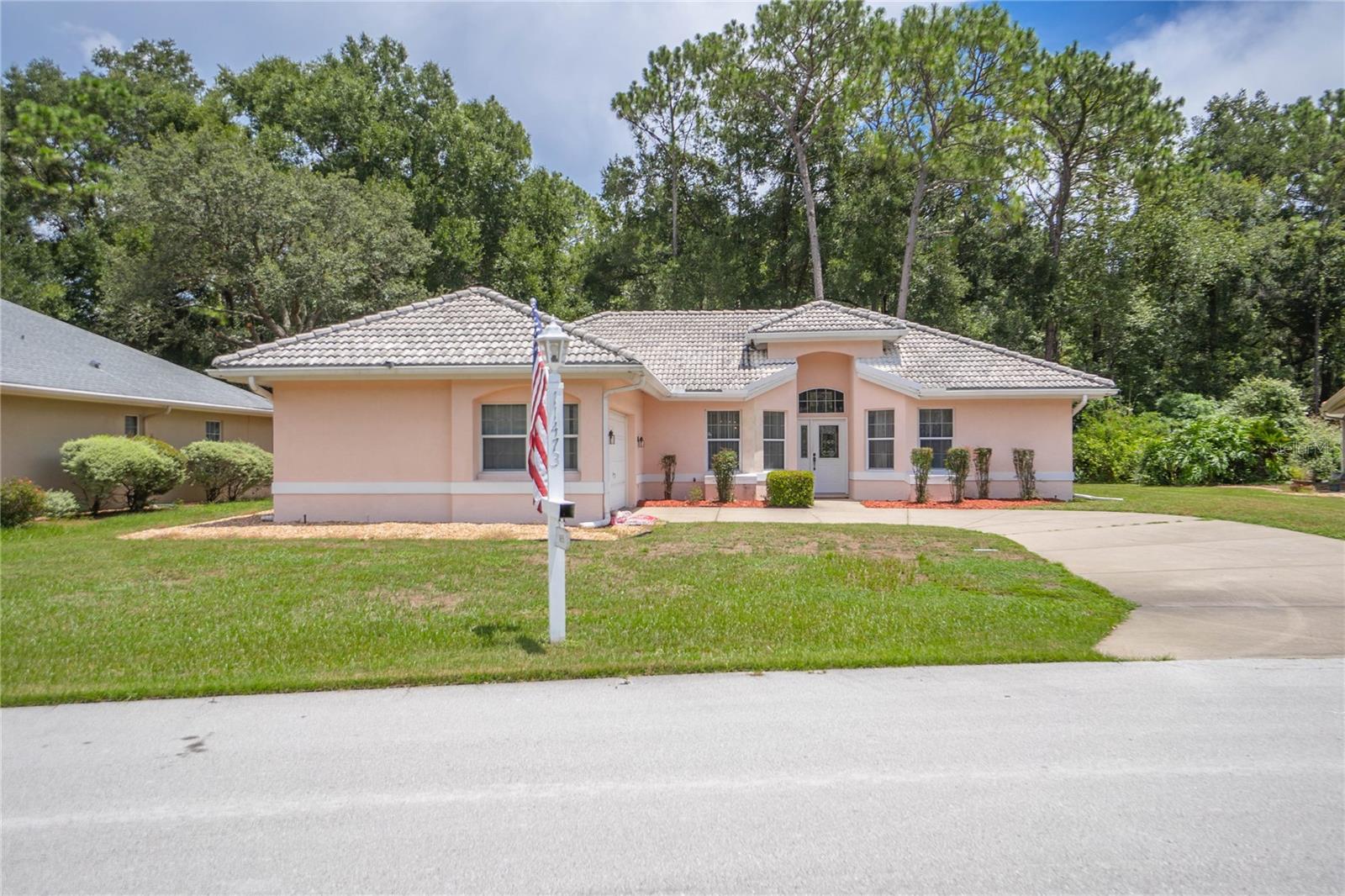 This home is the sought-after and hard to find Oak Run model – the Capri Extended – including with side-load garage being offered by the original owner. It is rock solid concrete block and stucco construction. Covered patio, 10’ x 24’ swimming pool with large, screened pool enclosure on 68’ x 16’ concrete deck. Private back yard with natural foliage for quiet and privacy. No homes are behind the house.
French doors open to the very large primary bedroom with vaulted ceiling and fan. Attached en-suite bath with dressing table vanity, tub, walk-in shower and block glass. Three large double-pane glass sliding doors opening directly on to the pool.
Kitchen has high ceiling, wood cabinetry and updated stainless appliances including electric range with exhaust hood, refrigerator and dishwasher, as well as track lighting and recessed lighting. Adjoining roomy eat-in breakfast nook has bump out windows overlooking the pool. The dining room has bump out windows overlooking the front yard, with light fixture matching that of the foyer.
Recessed front door has cathedral and side glass panel, and half-moon upper window -- all with vertical blinds. Tiled foyer with light fixture matching dining area. Roomy living room with vaulted ceiling and fan has three very large windows overlooking the pool.
Double French doors open to the second bedroom with large walk-in closet, two front-facing windows and ceiling fan.
Second bath has a walk-in tiled shower with seat, private toilet with separate door, vanity with mirror, mirrored medicine cabinet and linen closet with modular shelving, The second bath has extra door opening directly onto the covered patio and pool area.
Utility room has closet and opens to plus-size two-car garage. This can easily be converted to the inside laundry room. Garage has automatic double door, washer and dryer, utility sink, electric water heater, electric panel, Toro 9-channel irrigation controller, and internet link-up et al.
Oak Run resort style living features six swimming pools including year-round indoor pool with free swim, lane swim and water volleyball – as well as two modern fitness facilities with fitness classes. outdoor and indoor pickle ball, tennis courts, shuffleboard, bocce ball, billiards, card room, ceramics, library, neighborhood cable channel and more than 50 clubs to join. Features Oak Room Bar and Grill restaurant. Royal Oaks Golf course membership available. Modest HOA dues. 55 Plus community. This property is out of probate in a matter of days.