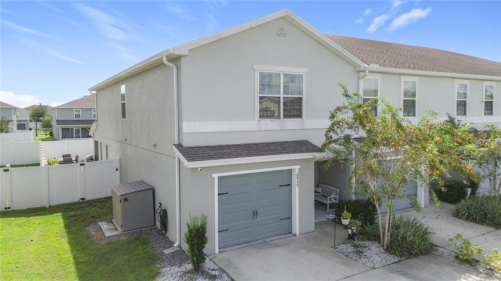 Ask about rates starting as low as 4.99%! Built in 2020 with UPDATED FEATURES! Welcome to 2935 Fieldwood Circle – a beautiful move-in ready and well-maintained end-unit townhome in the desirable community of Gramercy Farms in St. Cloud! This spacious 3-bedroom, 2.5-bathroom home offers over 1,800 square feet of thoughtfully designed living space. The open-concept floor plan features a spacious dining and living area, ideal for entertaining or everyday living. The first floor provides the laundry space and access to the half bathroom along with the common areas. Interior features include recessed lighting, luxury plank flooring, granite countertops, stainless steel appliances, water softener system included and reverse osmosis system in the kitchen! Upstairs, you’ll find all three bedrooms, including a generous primary suite with two closets offering ample storage space. The additional bedrooms are well-sized, and the home boasts multiple storage options throughout, making organization a breeze. The primary bathroom offers dual sinks and a walk-in shower, and you will love the jack and jill bathroom shared between the other two bedrooms, offering multi-generational use or a private guest suite. Step outside to your private outdoor retreat—enjoy the screened lanai and a custom outdoor patio with pavers in the fully fenced backyard, perfect for relaxing or hosting gatherings. Rounding out the home is a one-car garage with an epoxy-coated floor and automatic garage door opener, offering both style and functionality. The HOA takes care of lawn maintenance, irrigation and provides access to fantastic community features, including a park, playground, and sidewalks throughout the neighborhood—perfect for leisurely strolls. Located in the desirable Gramercy Farms community with easy access to schools, parks, shopping, and major roadways—this move-in-ready home is one you won’t want to miss!