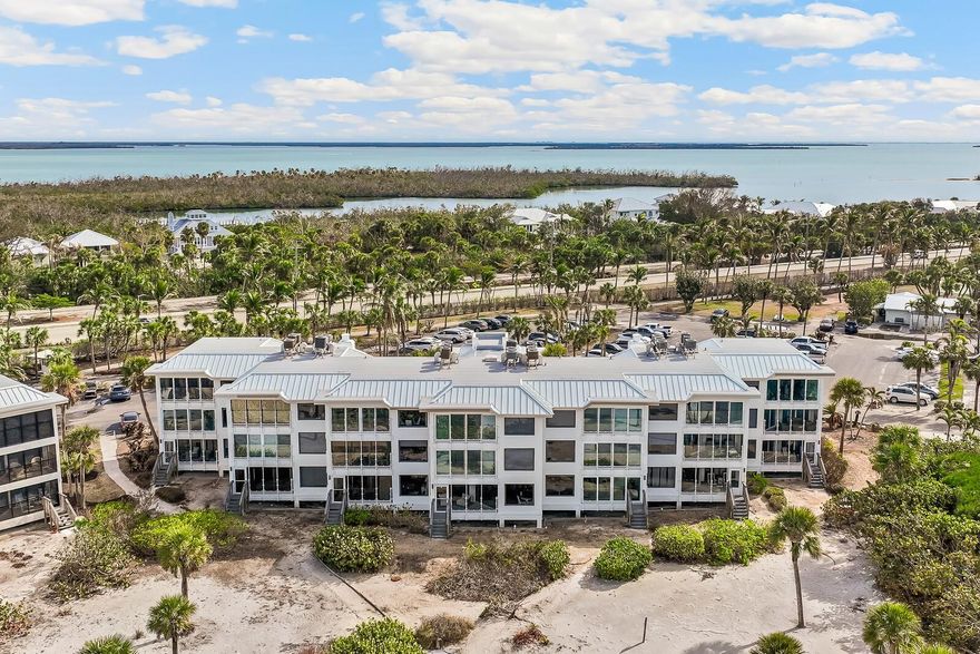 Enjoy expansive views of the Gulf from this desirable 1 bedroom, 2 bath waterfront condominium where the beach literally becomes your backyard. Located in the Dunes Chalet Association at the exclusive Boca Grande Club on Gasparilla Island, this first-floor beachfront condo with elevator access offers an open floor plan with high ceilings and high-end finishes. Recent renovations include new impact rated windows and doors, wide plank flooring, fresh paint, and new ceiling fans. Updates to the kitchen include quartz counter tops and stainless-steel appliances. The master suite has a walk-in closet, walk-in shower, and dual vanities with new lighted mirrors. Recent building improvements by the Dune Chalet Association include a new roof, new exterior doors, updated lighting, and sleek glass railings for unobstructed views of the white Gulf beaches and stunning sunsets. A nearby dunes walkway leads to an uncrowded beach. The Boca Grande Club is a private members only beachfront community offering 3 heated pools, an exquisite waterfront dining room, a poolside Tiki Bar, 8 Har-Tru tennis courts, a pro-shop with a robust tennis program, and a newly updated fitness center. This rare combination of luxury amenities, pristine location, and turnkey condition creates an exceptional opportunity for discerning buyers seeking the ultimate Florida coastal lifestyle.