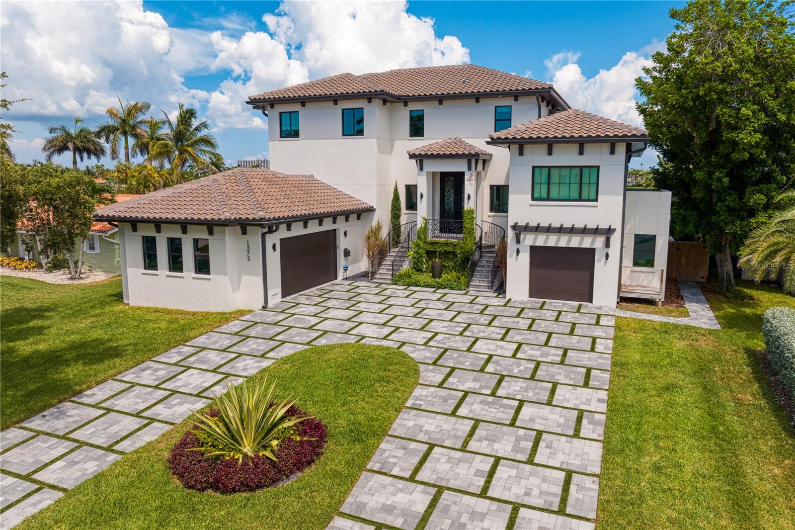 Accepting BACKUP OFFERS
Situated on a cul de sac in the highly desirable Yacht Club Estates this is a NEWER construction DREAM!! Built in 2021 this ALL block with reinforced concrete pilings waterfront home will take your breath away. This stunning home boasts 5 bedrooms, 4 bathrooms, 3 car garage, theater room, office, wine wall, bonus rooms, storage, multiple fireplaces, infinity pool with sunken fireplace, wet bar, coffee bar and an outdoor kitchen. This move in ready home is the epitome of the Florida Dream with water views from every bedroom. Just minutes to the beaches and within 35 minutes to Tampa International Airport.
So many exquisite details to uncover you must come look for yourself! Dock plans are ready and in the process of being built.